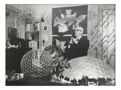 Framed Photograph of Buckminster Fuller: Shown seated in his office, surrounded by his various construction models. Inscribed by Fuller to Jean Bach. From the Estate of Jean Bach. Dimensions: Framed - 8" H x&nb