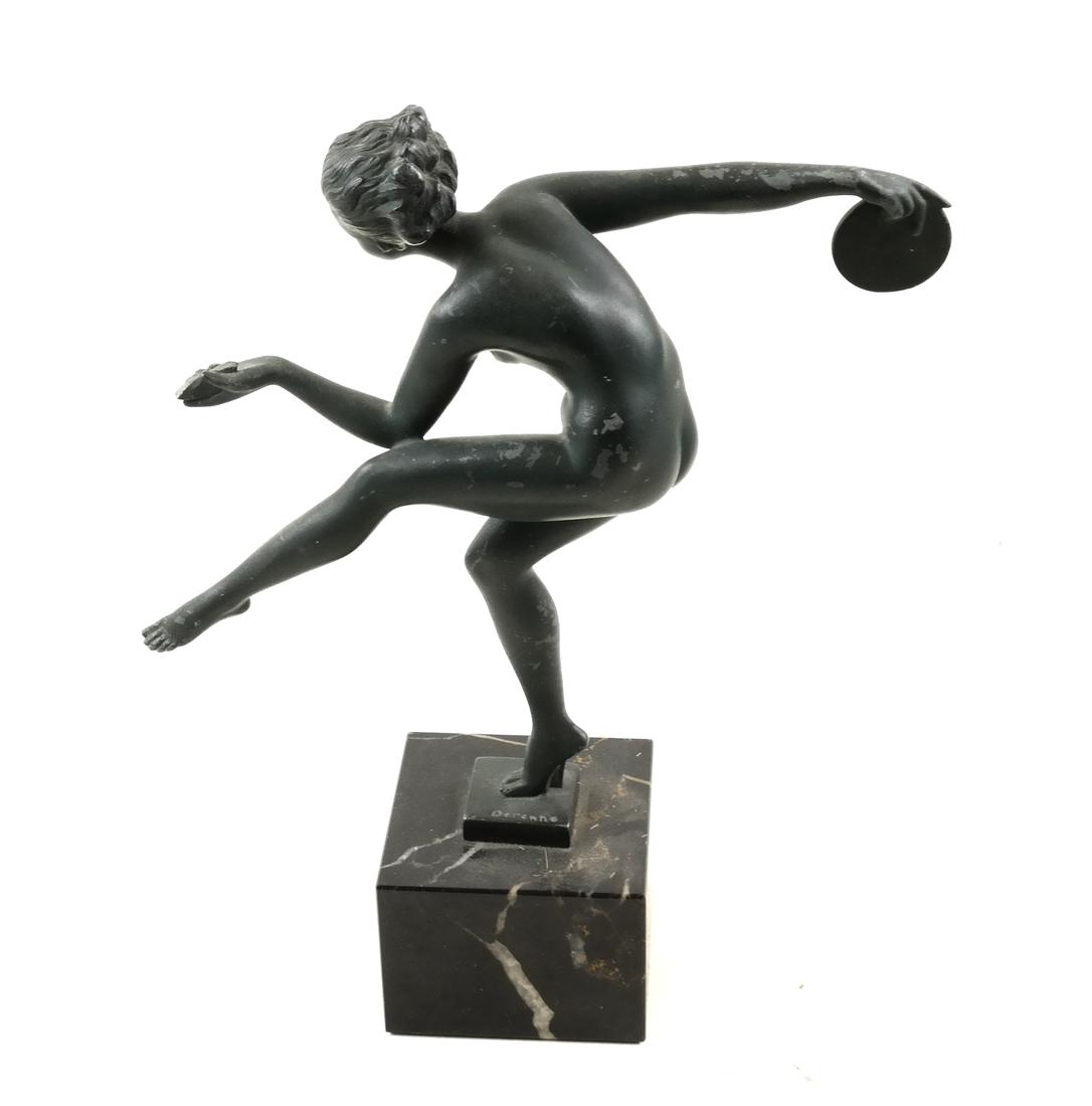 Marcel Bouraine a.k.a Derenne - Female Sculpture: A metal figure of a nude dancer with a discus. Signed "Derenne." Dimensions: 9" W x 3" D x 10.5"H; 