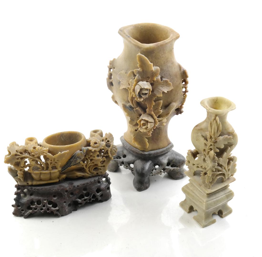 Three Chinese Carved Hardstone and Soapstone Urns: All with carved flowers and foliage on integral bases. Republic period, 20th century. Dimensions: Tallest - 8" H ; 