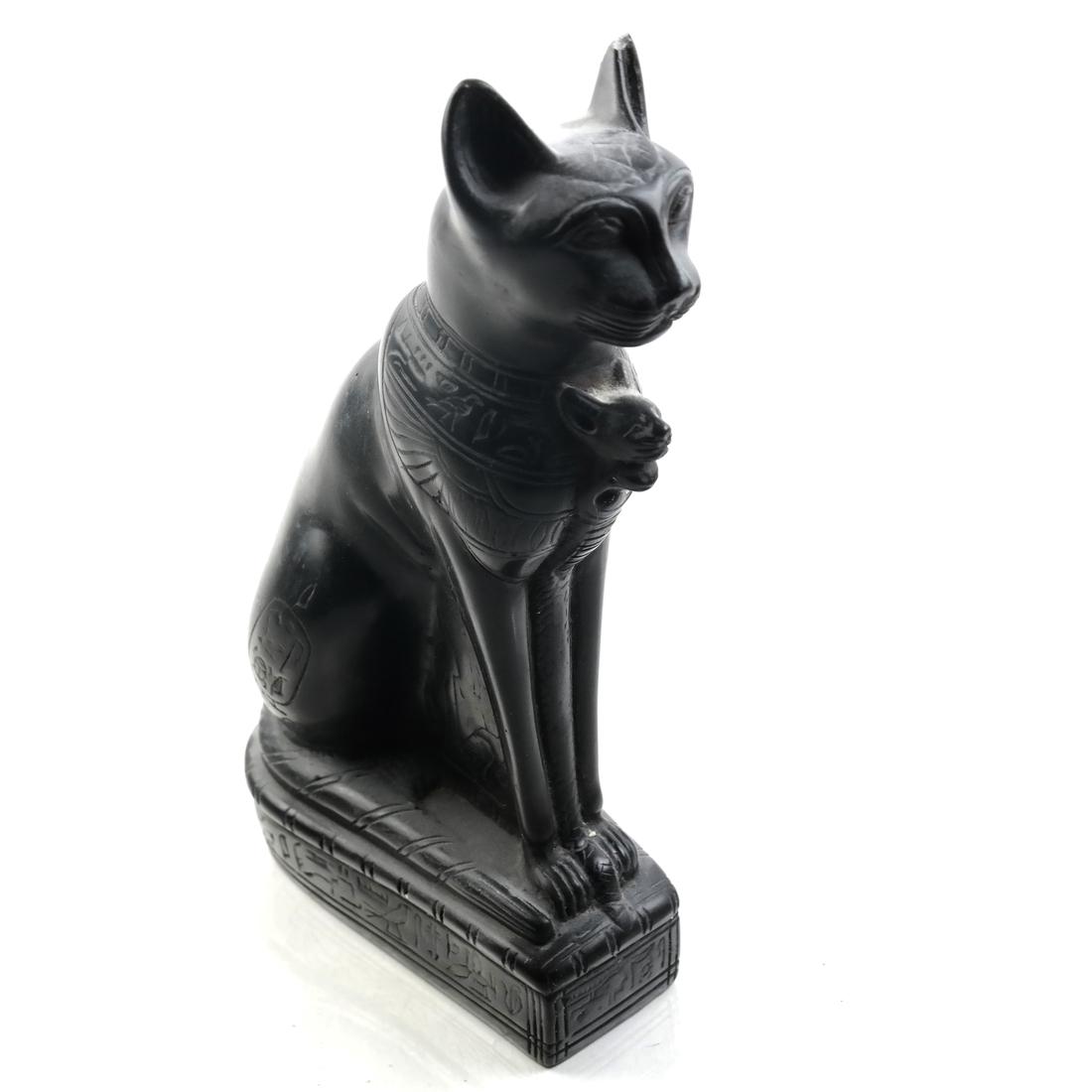 Egyptian Sculpture of Cat: Obsidian sculpture of a cat with lightly carved hieroglyphics and other symbols. 20th century. Dimensions: 5.5" W x 2.5" D x 10.5"H; 
