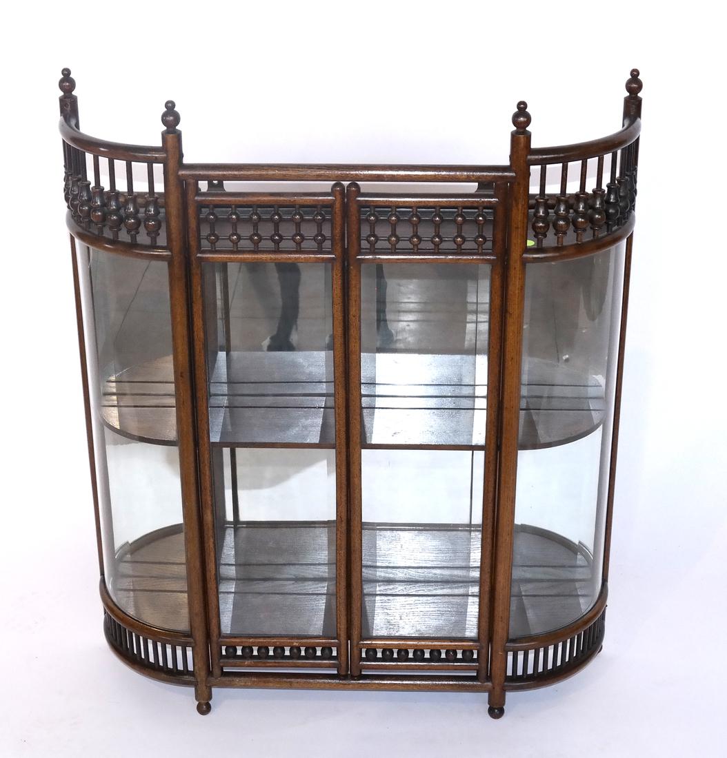 English Oak Spindle-Form Hanging Cabinet: English oak spindle-form cabinet. Dimensions: 26.5" W x 5.5" D x 32"H; 
