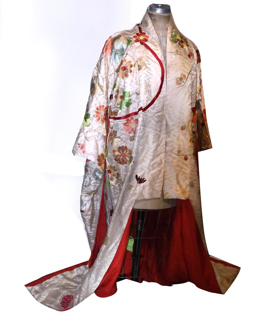 Japanese Kimono, Uchikake: With extensive embroidery in gold and copper colored threads on off-white figured silk. 67 3/4in long from base of neck to hem. Mid- to late 20th century.