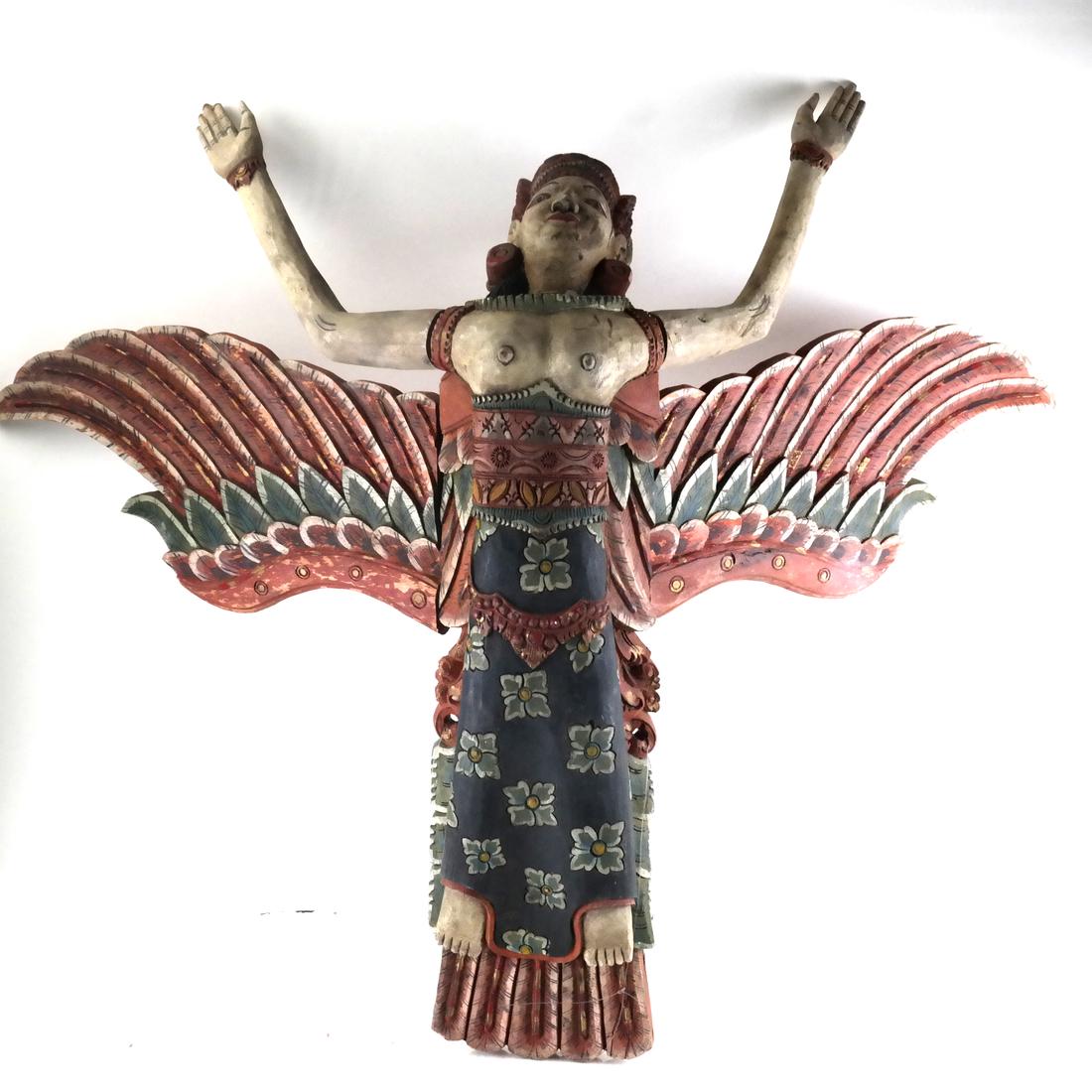 Indonesian Antique Carved Wood Sculpture: Indonesian antique carved wood sculpture of flying figure, modular arms and legs. Dimensions: 29.5" W x 32.3" D x 17.75"H; 