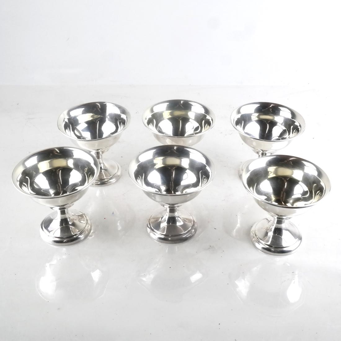 9 Silver Champagne and Martini Coupes.: Unmarked. Mid-20th century. Tall- 9.875 ozt. Short- 7.535 ozt. Total weight: 17.41 ozt. Dimensions: 4.5" H ; 3.4" H ; 