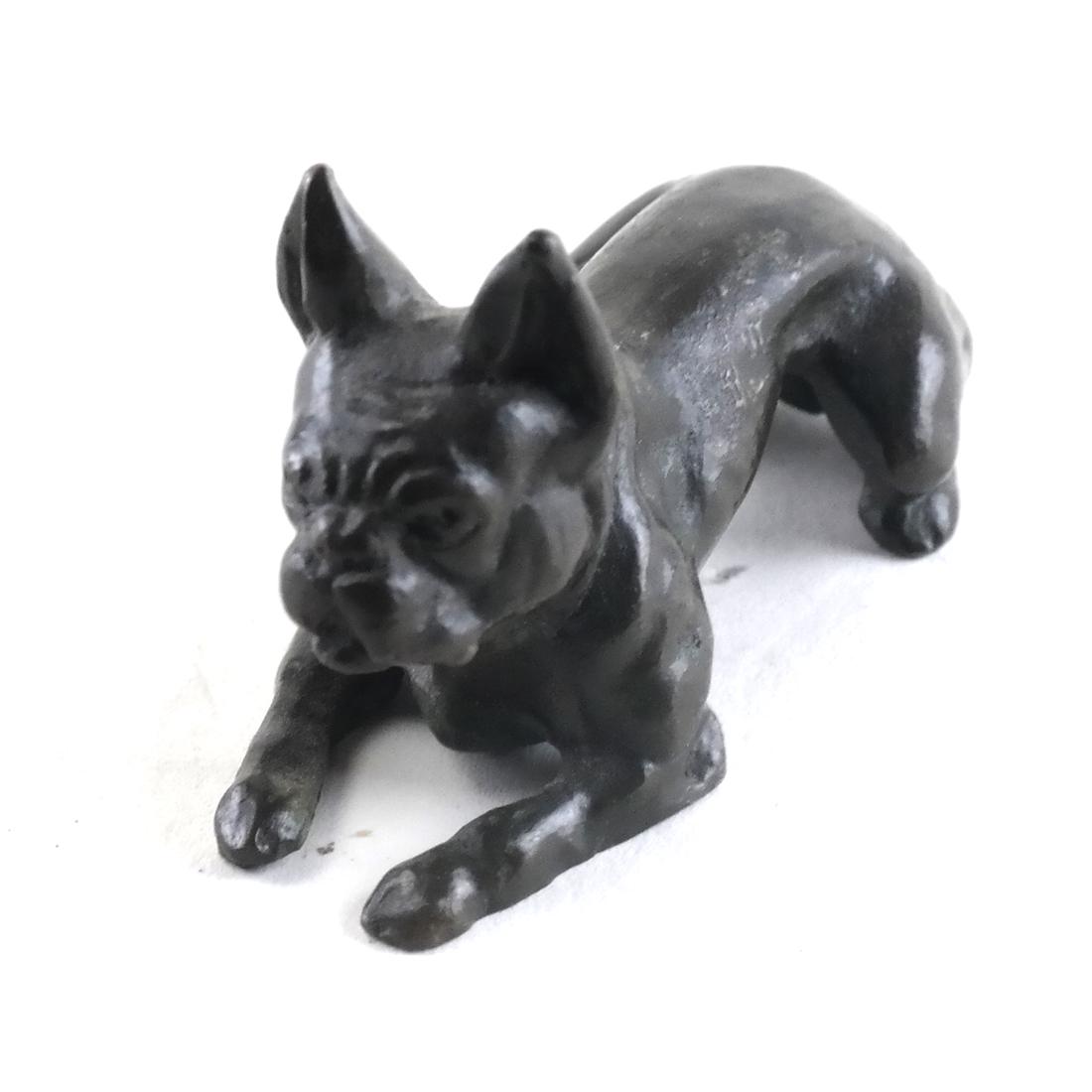 Tiffany & Co., Bronze Boston Terrier: Tiffany & Co. bronze sculpture of a recumbant Boston terrier, ears pricked up. Marked to underside. [1 x 3 inches]. From the Canine Collection of Fred Kass, Brooklyn, NY.
