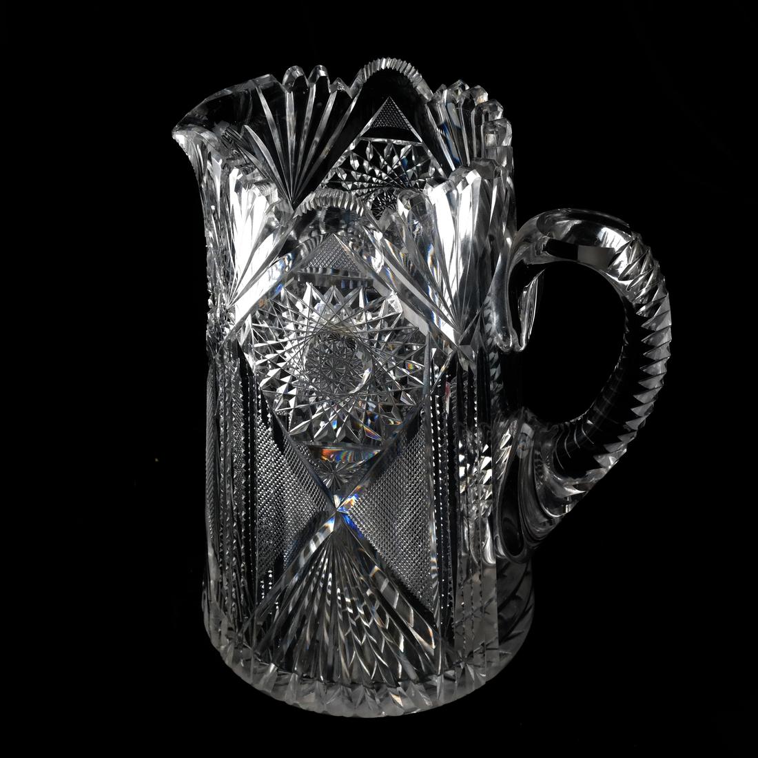 Pairpoint-Type Cut Glass Pitcher: American Pairpoint-type glass pitcher. Circa 1920. [9 inches].