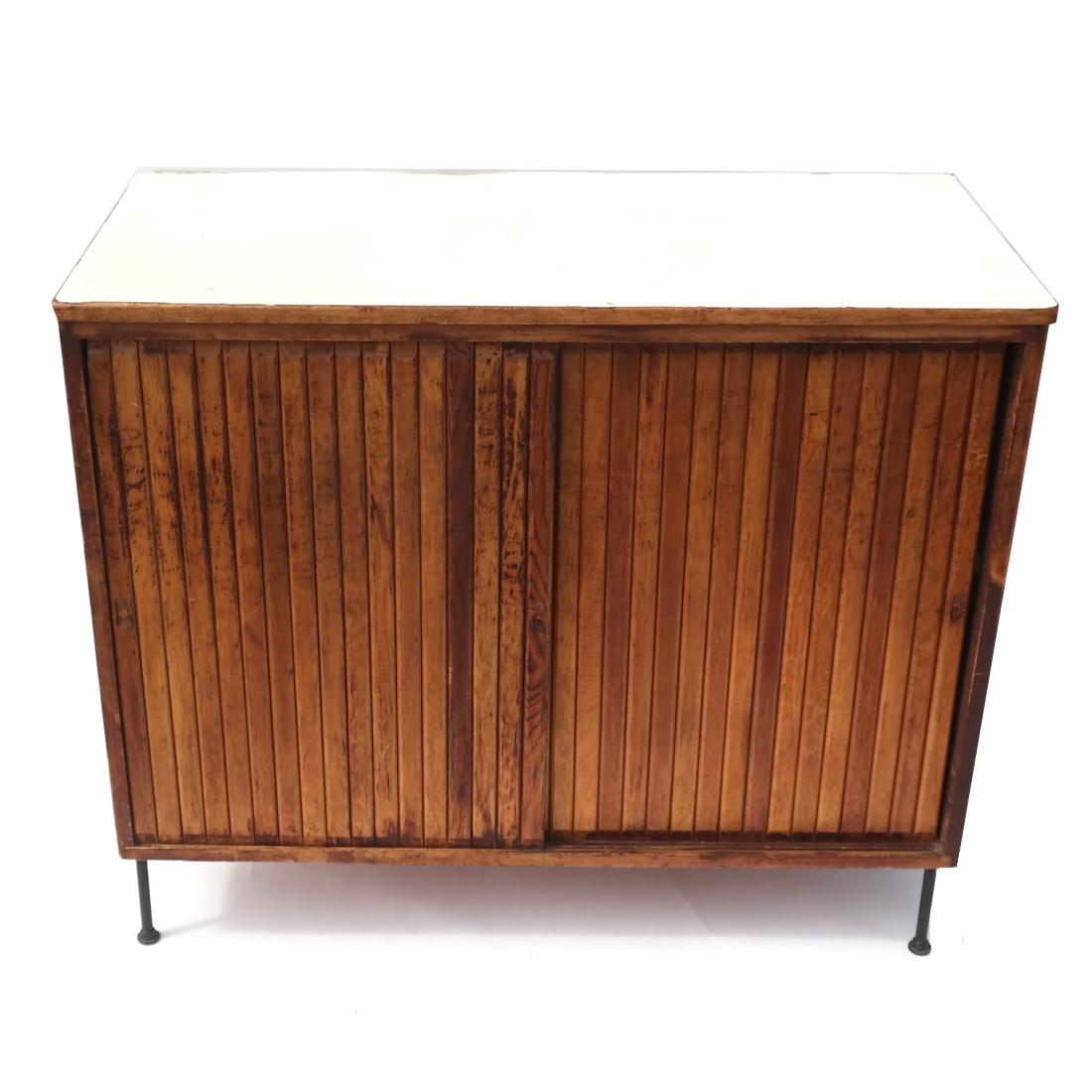 American Mid-Century Modern Cabinet: With painted top, beaded doors, and steel legs. Circa 1965. [30 1/2 x 35 3/8 x 16 1/4 inches].