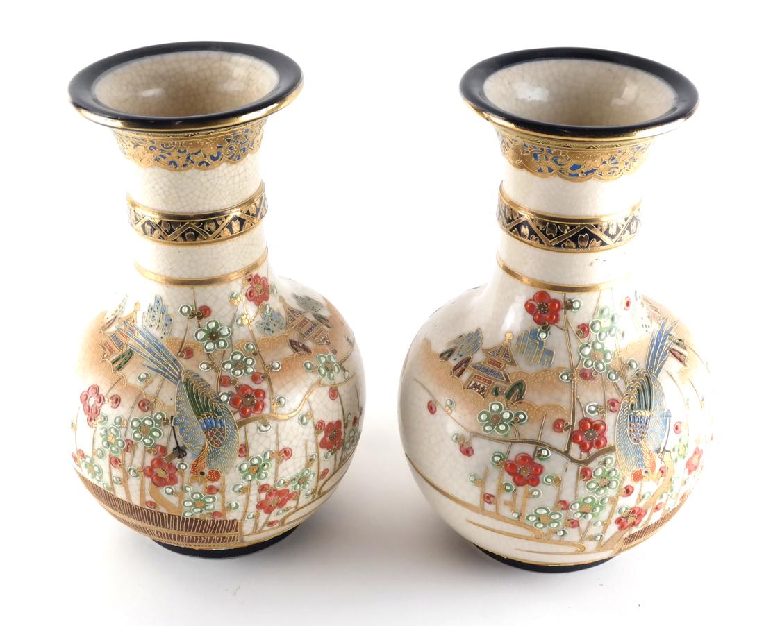 Japanese Pair of Sumida Ware Vases: Japanese porcelain pair of Sumida ware vases, with raised florettes, birds, etc. Marked to underside, circa 1950. [9 1/2 x 5 1/2 (dia) inches].