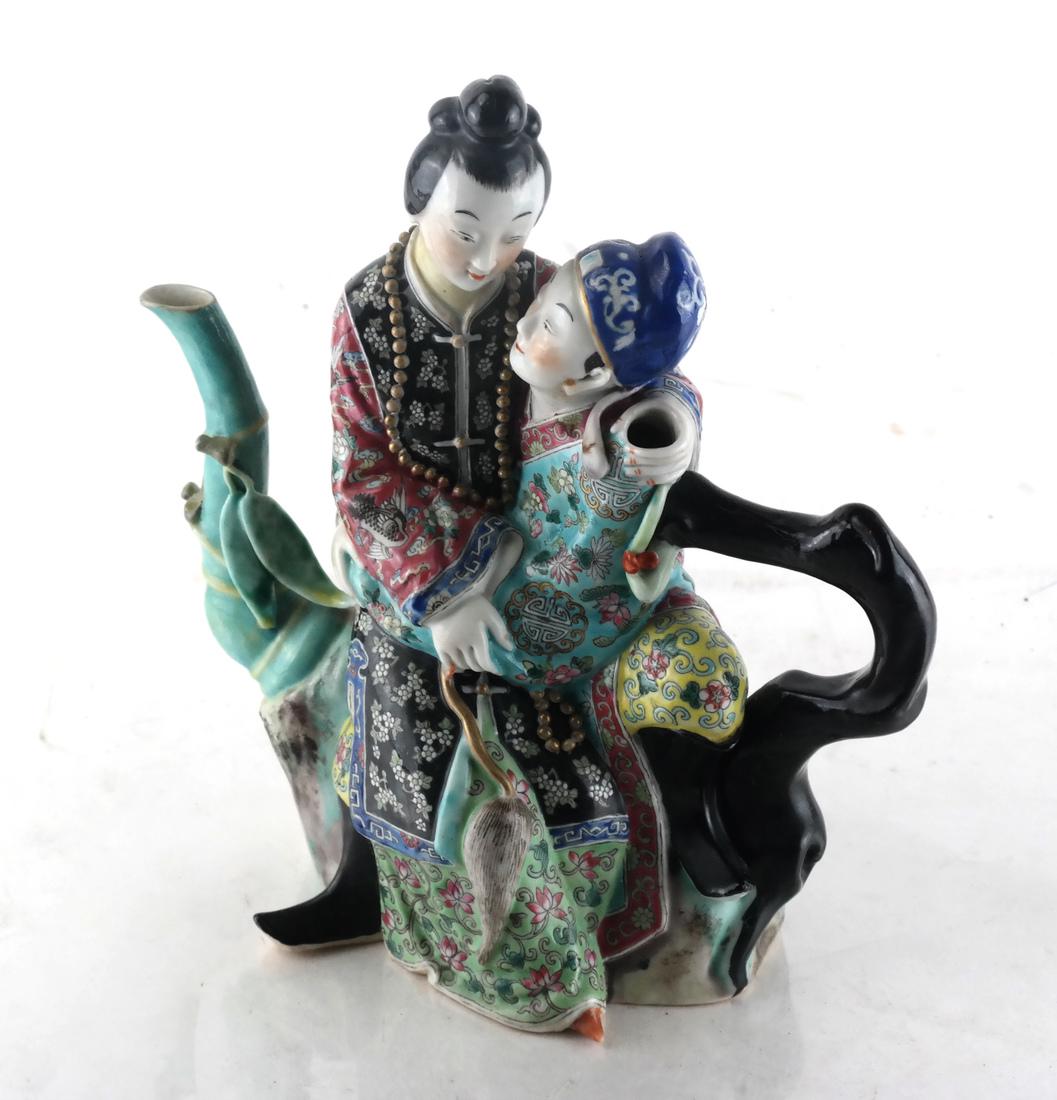 Chinese Porcelain Famille Jaune Teapot: Puzzle teapot with figures of romantic lovers. [8 x 7 x 4 inches].