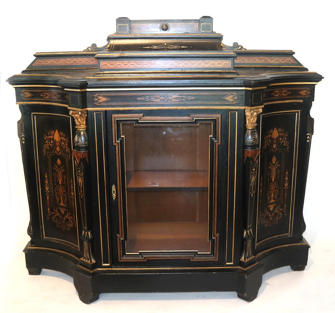 Victorian Ebonized Inlaid Credenza: Victorian ebonized inlaid credenza, bronze mounts, manner of Herter Bros., c. 1885. [56 x 63 x 17 inches]. One side with veneer damages, some repainting to gold paint hinge absent, glass door.
