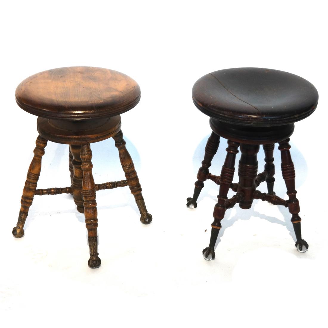 Two Antique Swivel Piano Stools: Two antique swivel piano stools, one with a split seat. [19 1/2 x 14 (dia) inches].