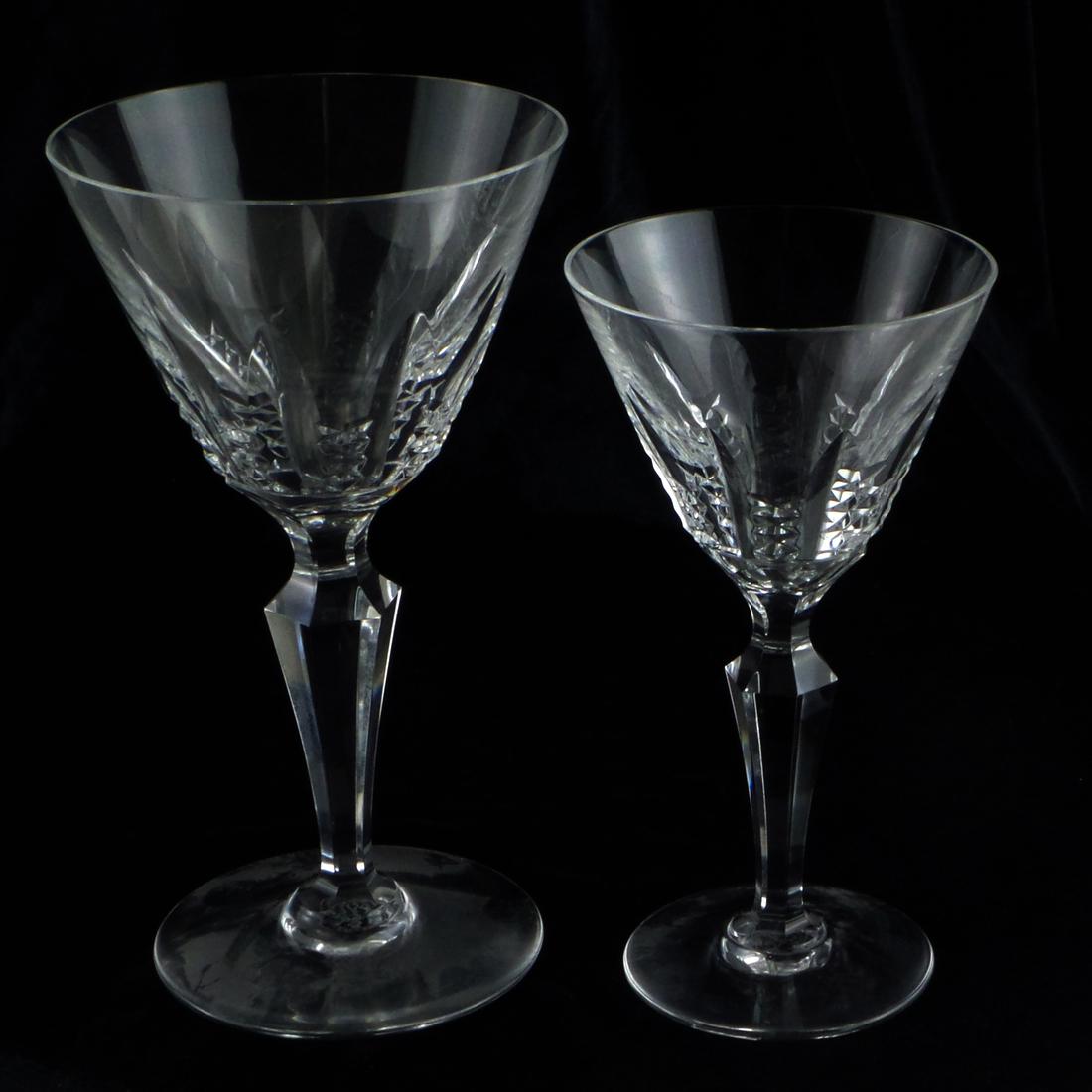 Ten Baccarat Crystal Stems: Ten Baccarat crystal stems, including four wine glasses and four champagne glasses. [7 x 4 (dia) inches; 6 x 3 1/2 (dia) inches]. In overall good condition.