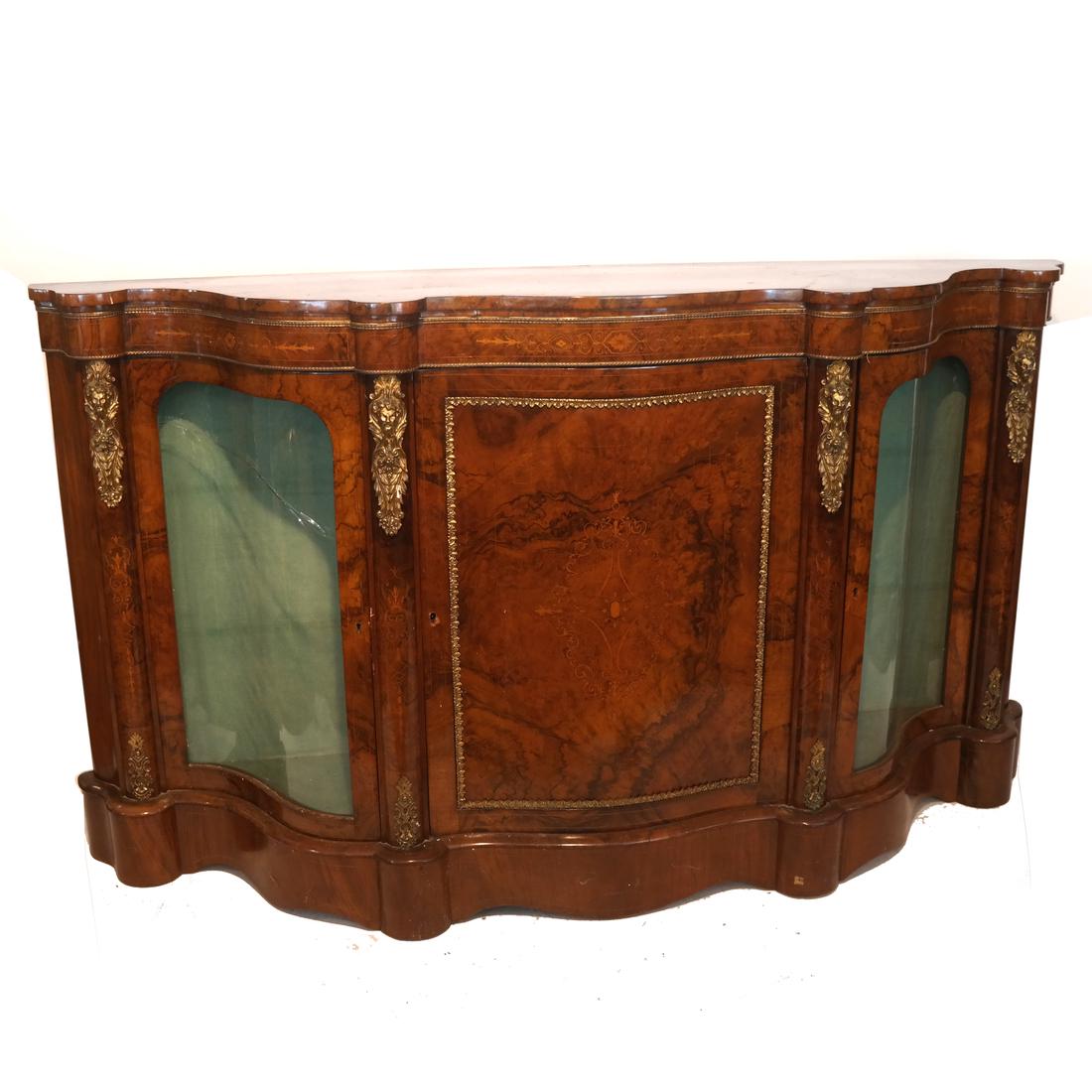 Continental Inlaid - Ormolu Credenza: Continental - English scallop-form credenza-cabinet with glazed sides. [43 x 77 x 17 1/4 inches]. Crack to glazing on one side, minor chipping to veneers.