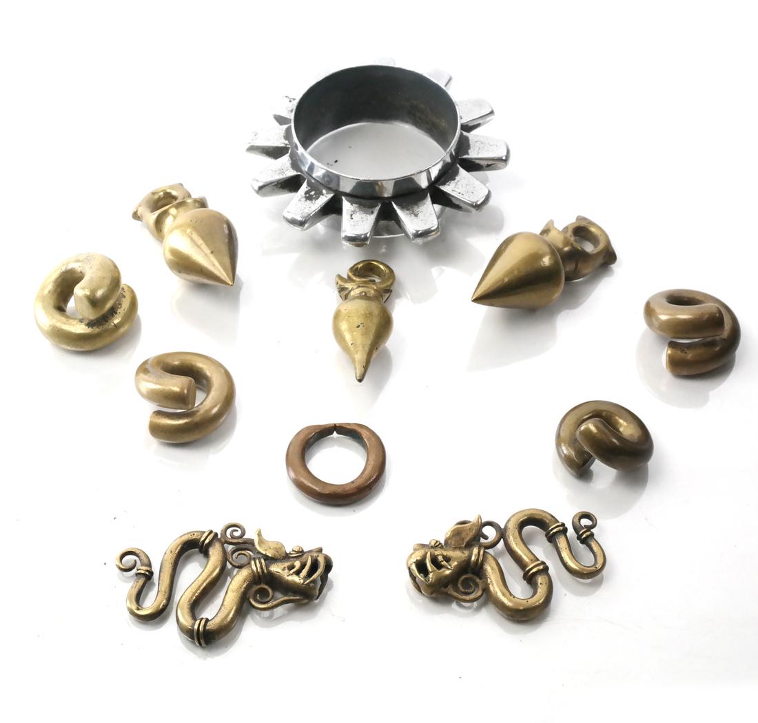 African & C. Asian Rings, Currency, Cuff: Collection of African and Central Asian rings, currency, weights and decorations, and a metal cuff. 20th century.