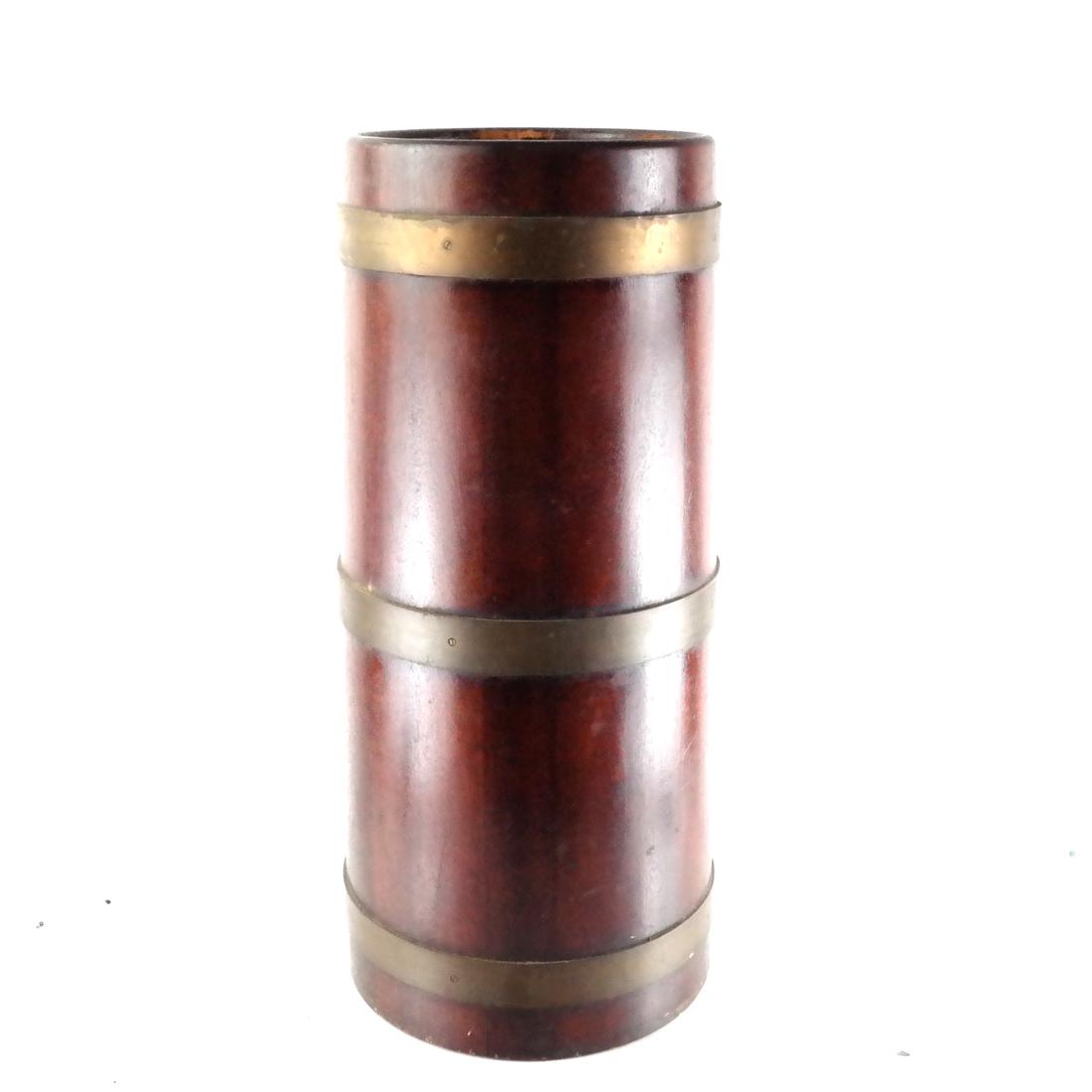 English Wood, Brass Umbrella Stand: English wood and brass-banded umbrella stand, with a removable liner. [26 1/2 x 10 1/4 (dia) inches; Base: 11 3/4 (dia) inches]. Wear; in good condition as with age.