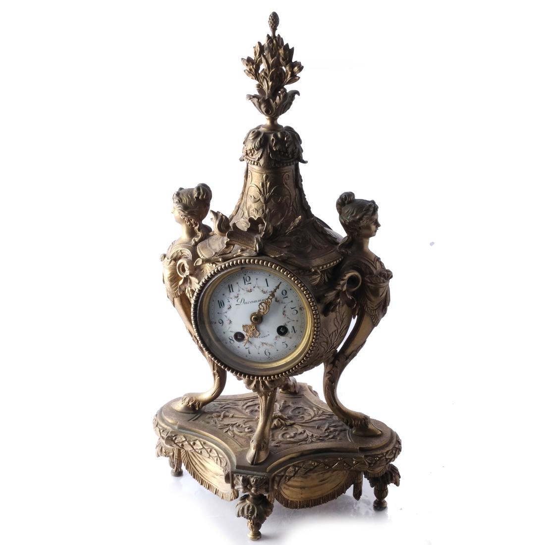 19th C. Ornate Bronze Mantel Clock: Ornate hoof-footed clock, two flanking female caryatids, with a pendulum. [17 1/2 x 9 x 7 inches].