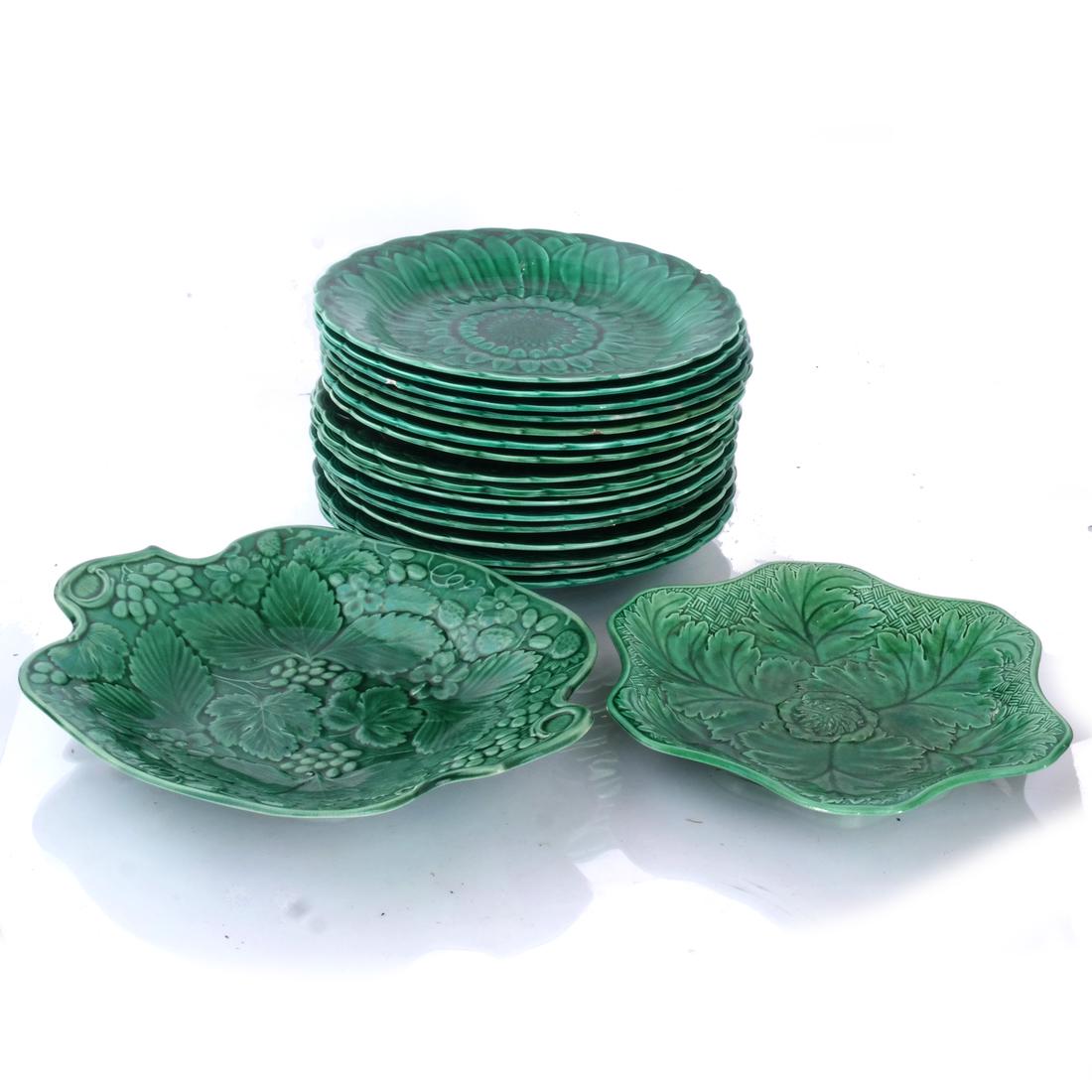 17 Wedgwood Celery-Style Plates: Including two scallop-form plates. [15 at 8 1/2 (dia) inches; 1 at 8 1/2 (dia) inches; 1 at 10 1/2 (dia) inches]. 5 with chips, one stapled, one with staples and chips.