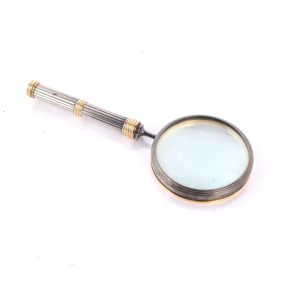 Stainless Two-Tone Magnifying Glass: Stainless steel two-tone magnifying glass. [7 x 3 (dia) inches].