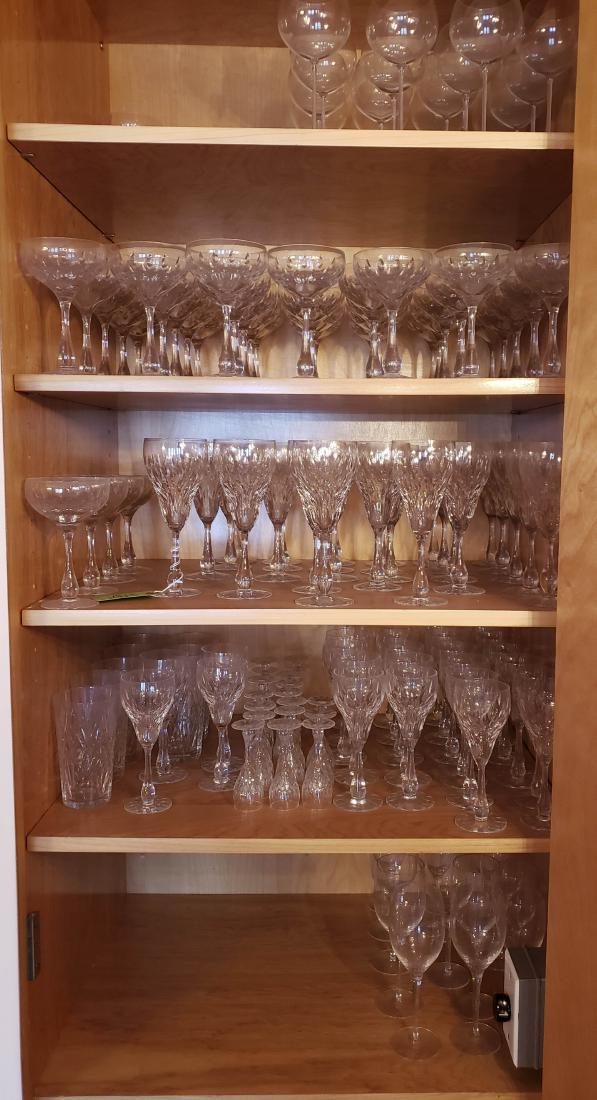 Waterford Crystal: Large Set of Stemware: Approximately 100 pieces of Waterford stemware, including champagne, red wine, white wine, and water glasses. Signed. In good overall condition.