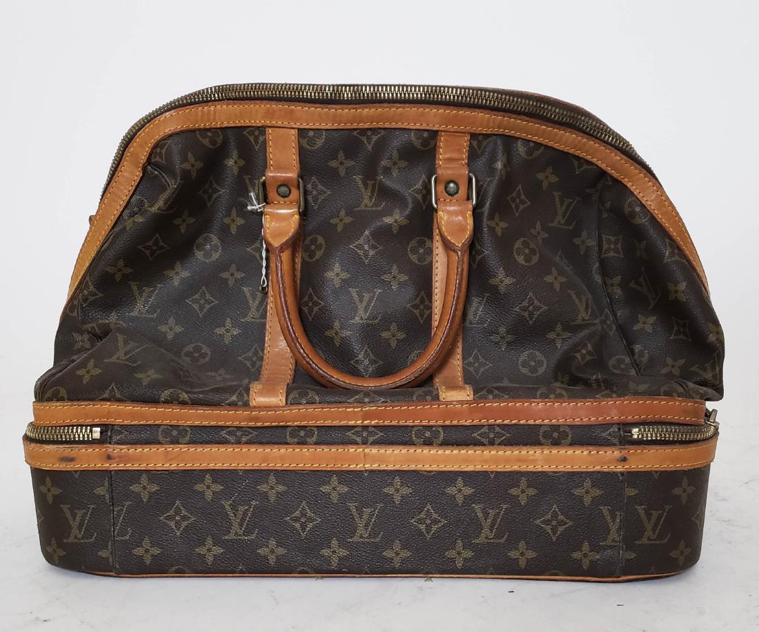 Louis Vuitton Travel Bag: Vintage Louis Vuitton leather travel bag, with show compartment. [14 x 16 inches]. Zipper working loose from bag.