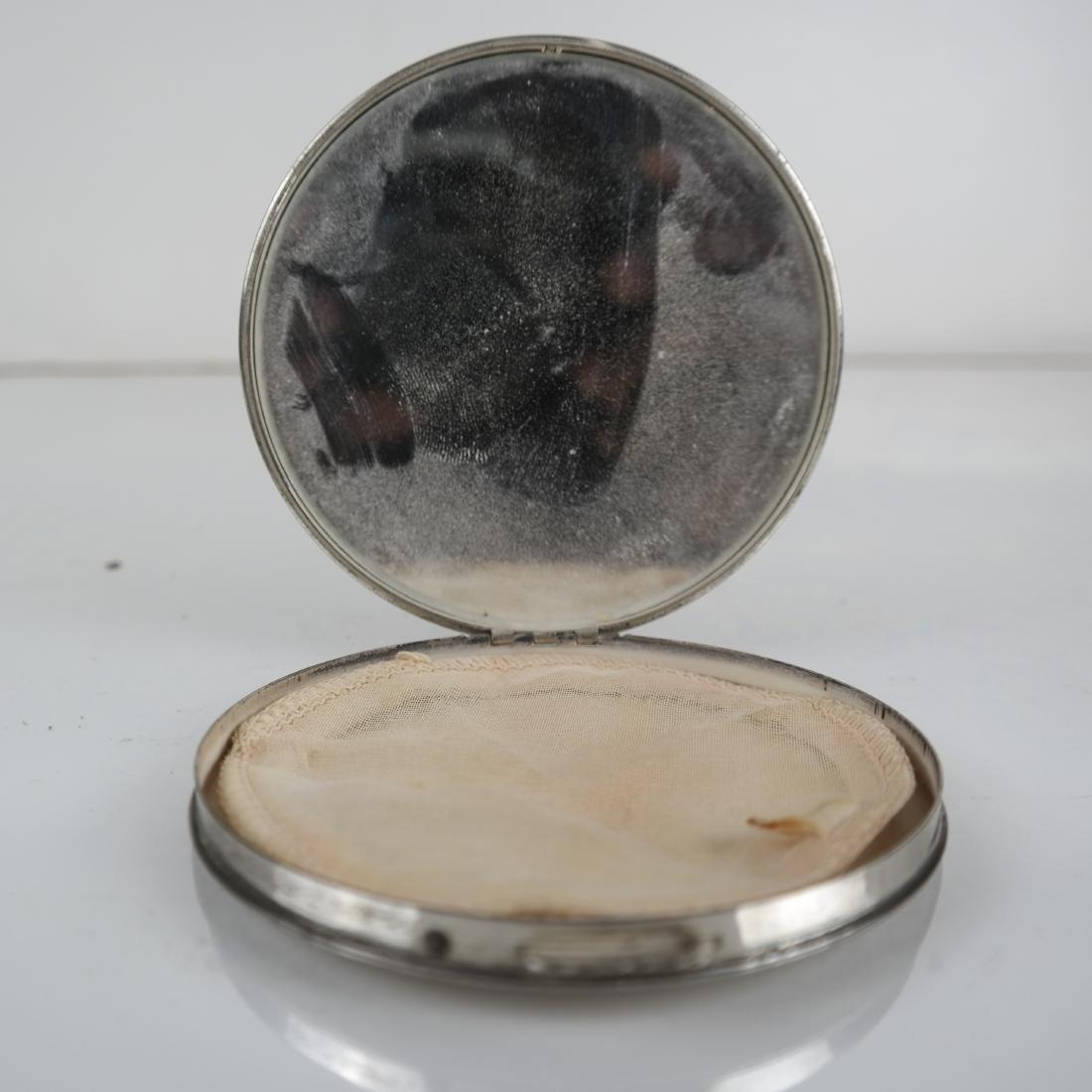 Round Guilloche Silver Compact: Silver compact with mirror and powder screen. Marked 'REX - SILVER" to side rim. [4 (dia) inches]. Tarnish, wear.