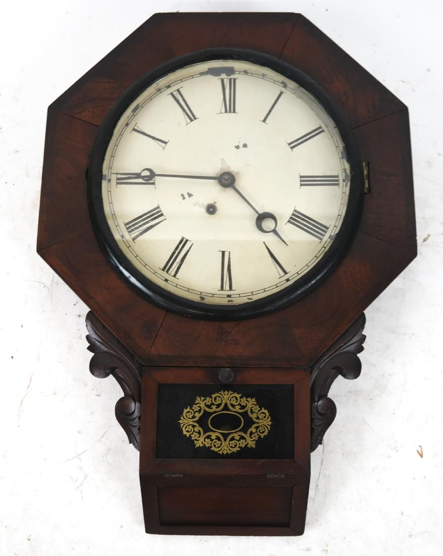 Victorian Wall Regulator Clock: Victorian wall regulator clock with a reverse painted lower door and metal face. [24 x 17 1/2 x 3 inches]. Metal face with wear.