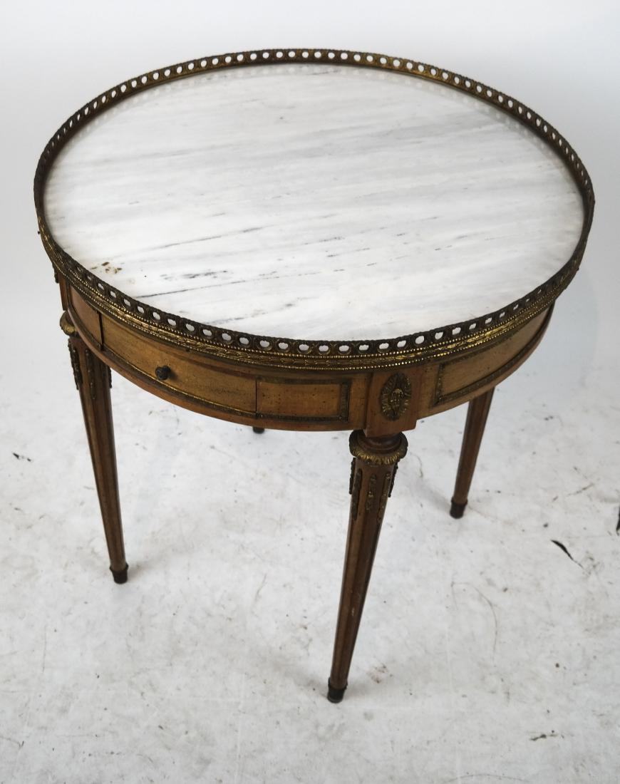 Louis XVI-Style Bouillotte Table: Louis XVI-style bouillotte table with a marble top, pierced gallery and ormolu mounts. [28 1/2 x 26 (dia) inches].