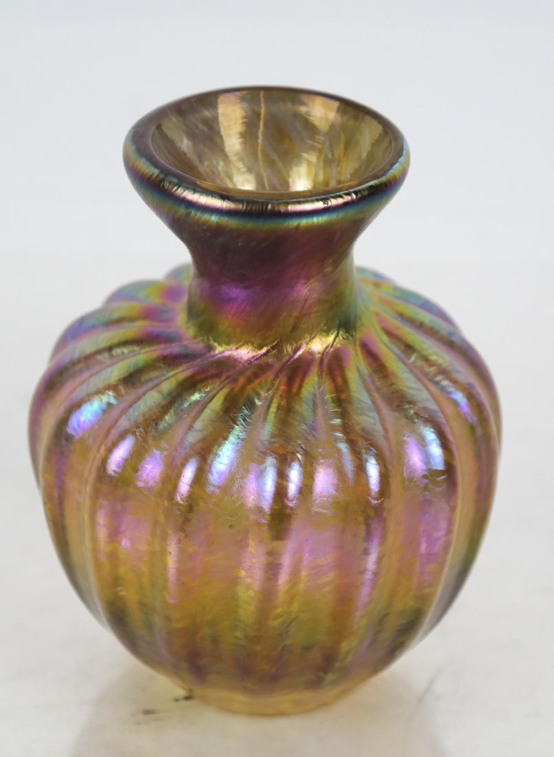 Iridescent Favrile-Style Glass Vase: Short, round Favrile-style iridescent art glass vase with fluted sides, not marked. [3 3/4 x 3 (dia) inches]. In good condition.
