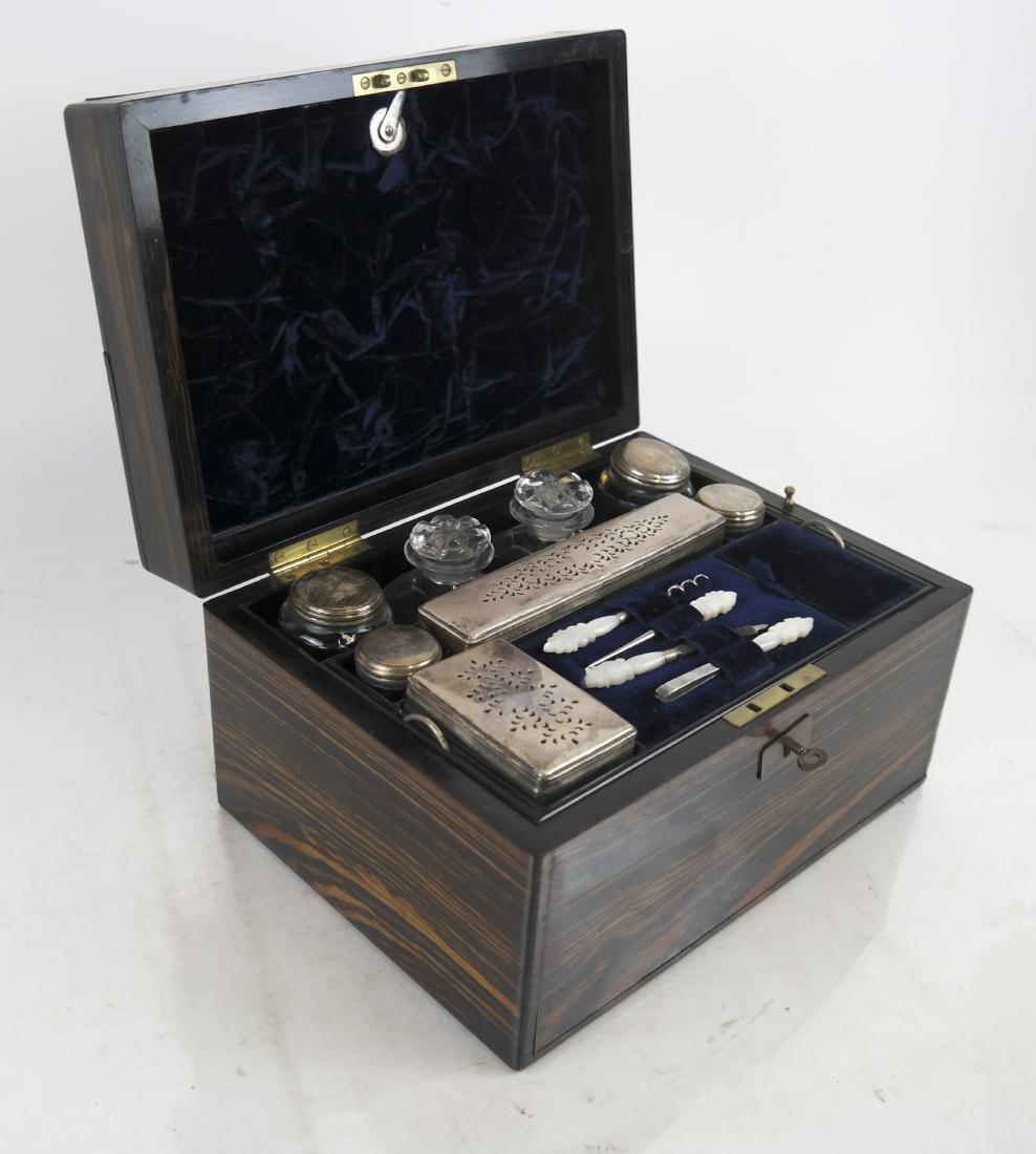 19th C. English Necessaire: 19th century box with fitted compartments, including bottles, grooming items and a removable caddy. Top inscribed "9-24-1854". [6 1/2 x 11 x 8 inches]. Escutcheon loose; key present.