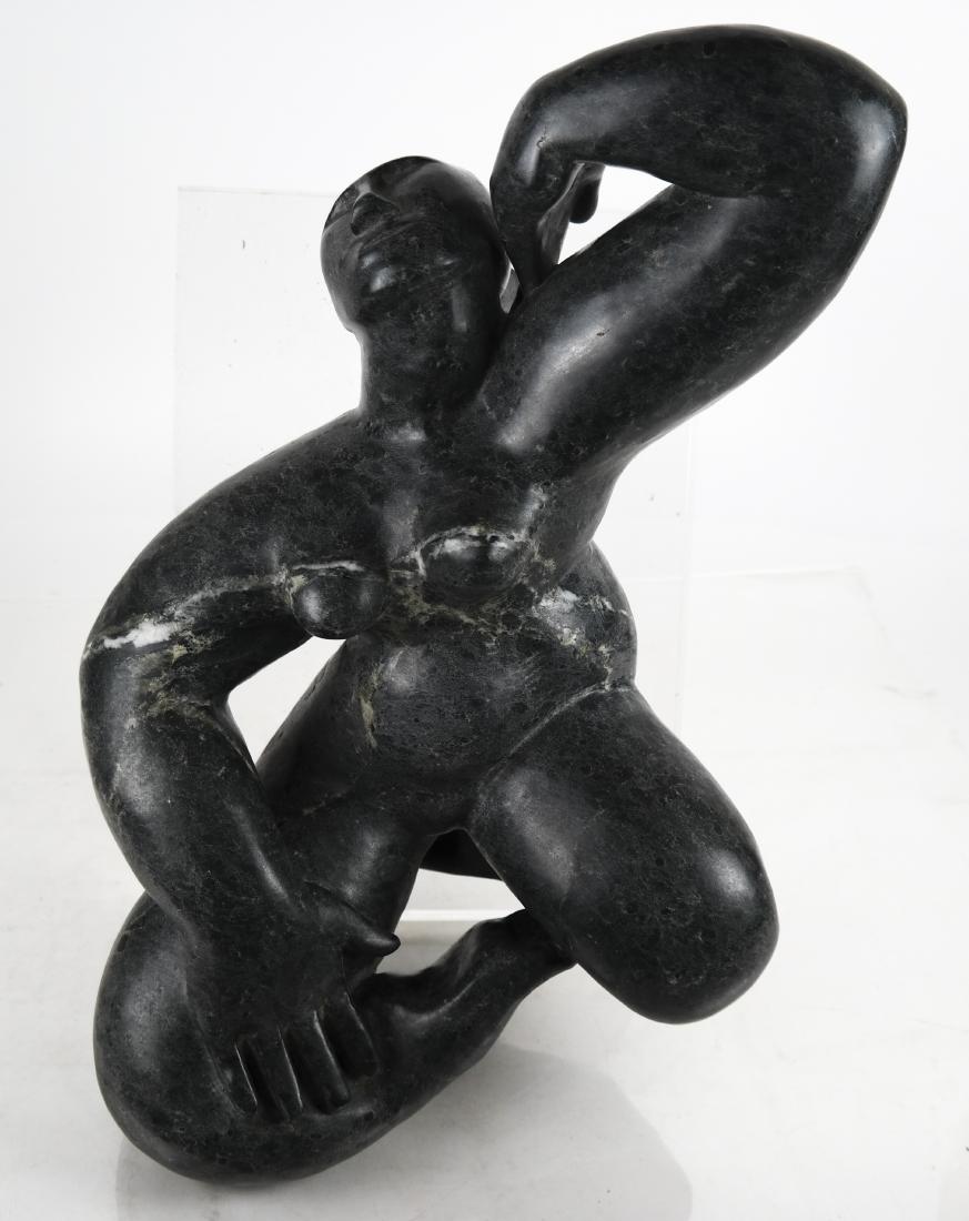 Leonora ARYE: Marble Sculpture of a Nude Woman: American 20th century marble sculpture of a nude woman, reclining with her legs folded and her head back, on an acrylic base. Signed "L Arye". [8 1/2 x 18 1/2 x 10 1/2 inches]. In good condition.