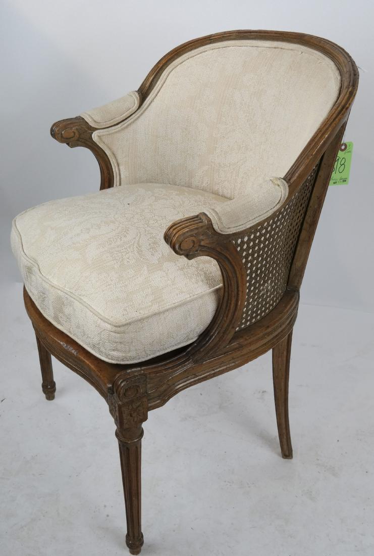 Antique Provincial Caned Seat Bergere: Louis XVI-style upholstered bergere. [34 1/2 x 22 x 20 x 17 to seat inches]. In good condition.