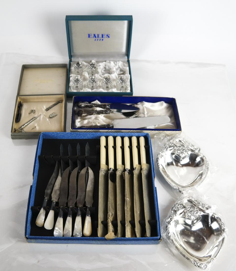 Lot of Jewelry, Silver Plate and Others: Lot of boxed items, including: 1) Box of rhinestone Art Deco-style pins, 2) a silver-plated 3-piece cheese set, 3) F.B. Rogers silver-plated Twin Hearts bonbon dishes, 4) Eales cut glass salt & pepper
