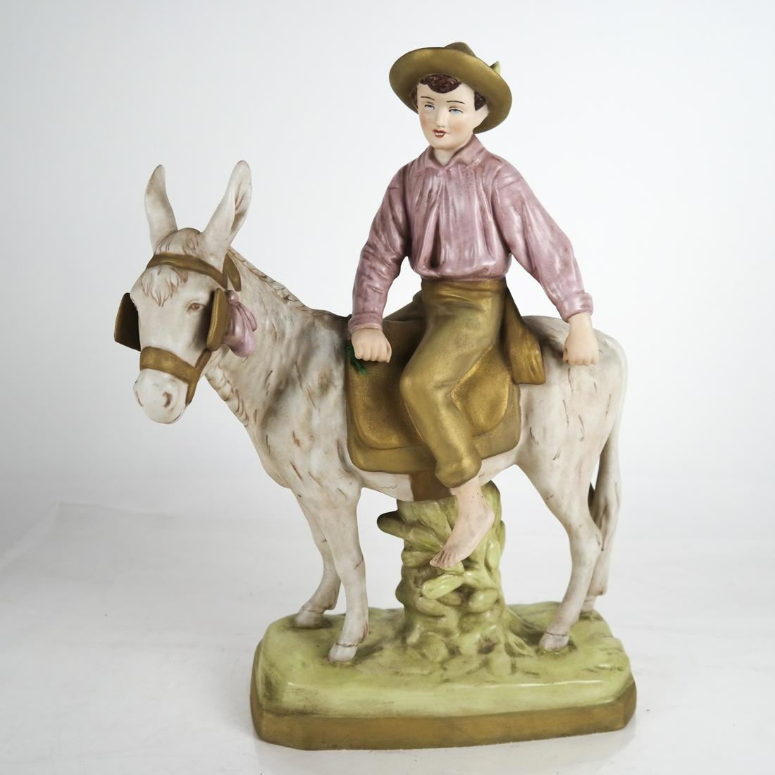 Royal Dux Polychromed Porcelain Figurine: Royal Dux polychromed porcelain figure on horseback. [14 x 12 x 6 inches]. In good condition.