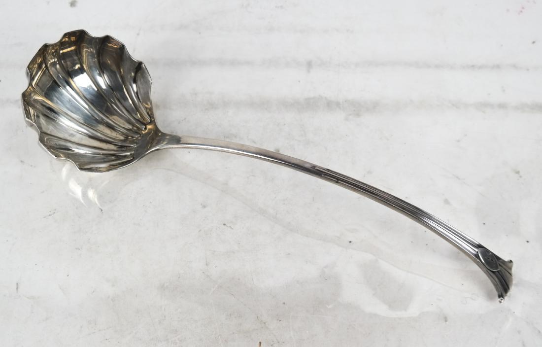 Late 19th C. Mappin & Webb Sheffield Silver Ladle: Late 19th century English Sheffield silver fluted ladle with trifid handle, made by Mappin & Webb, dated 1896, monogrammed and with registry 1:1ar. [13 inches long]. Weight 5.3 ozt. In good condition.