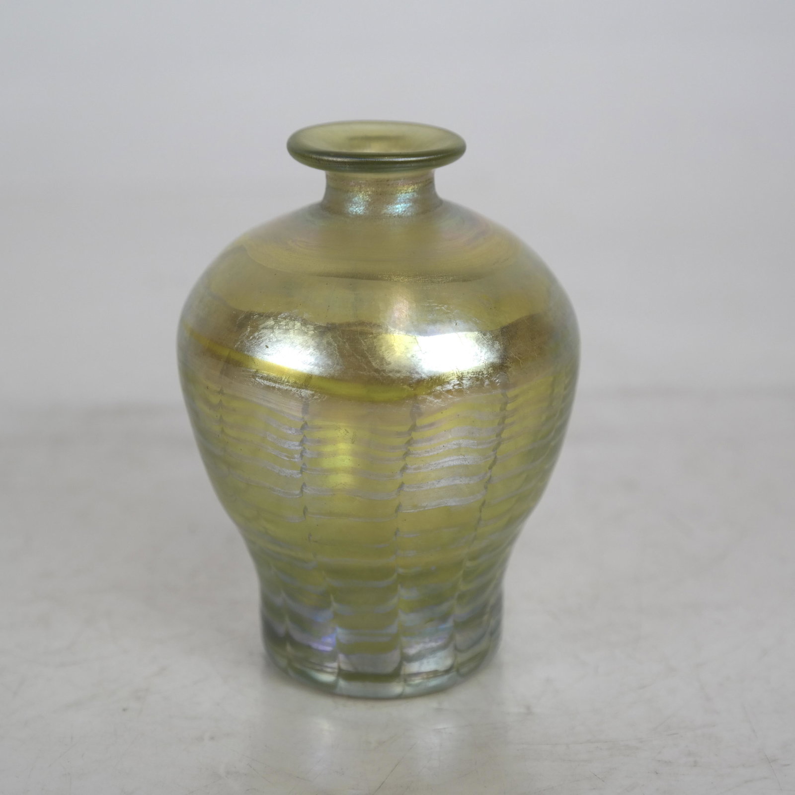L.C.T. Tiffany Favrile Vase #B813: Bulbous form with shaped top and rim #B813. [4 1/2 inches high]. In good condition.