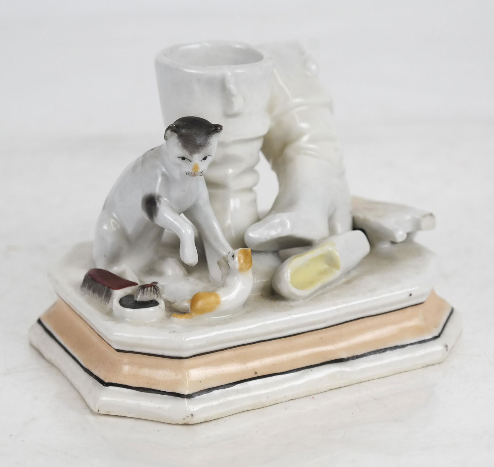 Match Strike and Holder: Match strike and holder, cats and kittens playing by boots. [3 x 4 1/2 x 3 1/2 inches]. In good condition.