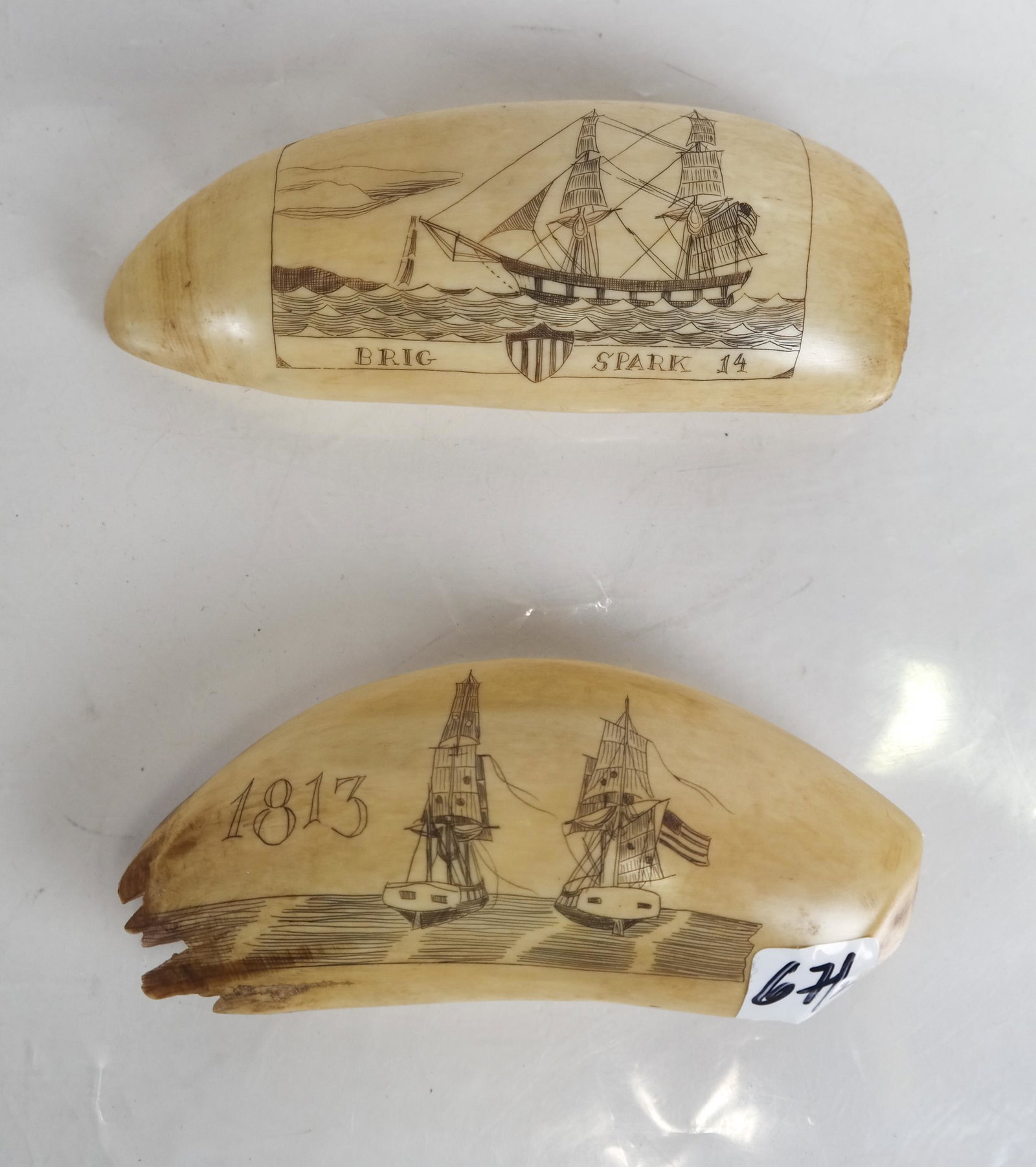 Two Scrimshaw Tooth Carvings - "1813" & "Brig Spar: 1) One depicting two sailing vessels heading side-by-side out to sea, engraved "1813" [5 1/4 inches], and 2) the other depicting a schooner sailing in rough seas with another vessel in view, bearing a