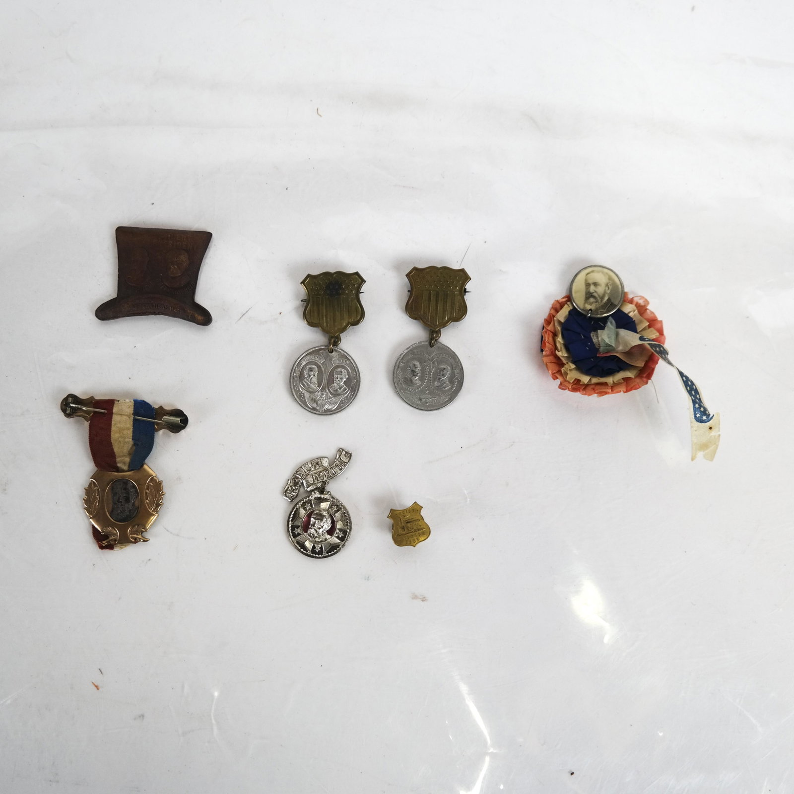 Lot of Harrison, Morton, Reid Items: Mixed lot of Harrison/Morton and Harrison/Reid campaign items, seven total, including three jugates, rosette and stud.