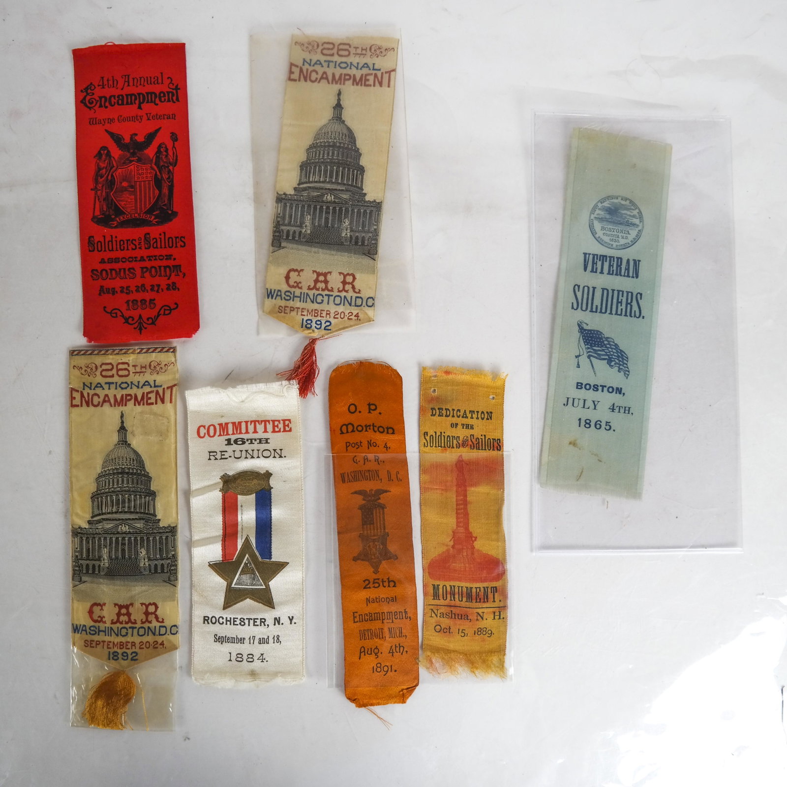 Lot G.A.R. Ribbons 1865-1892: Lot includes: July 4, 1865 "Veteran Soldiers" Boston Reunion ribbon featuring Seal of the City, 1630 [8 1/4 x 2 1/4 inches]; 16th Reunion 1884 Rochester, NY; 4th Encampment, Wayne County, NY 1885; Pos
