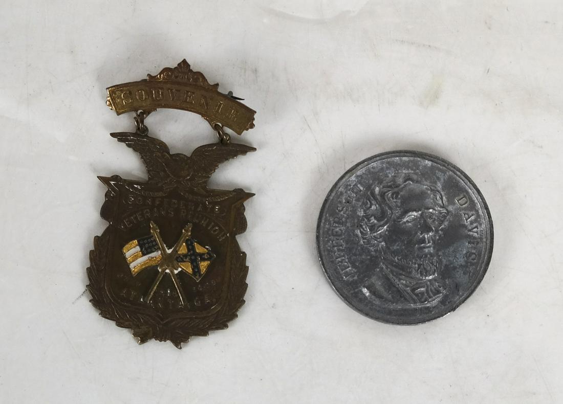 Jefferson Davis Token & Confederate Reunion Badge: JEFFERSON DAVIS white metal token, 35mm, strongly struck image, no reverse image, plus CONFEDERATE REUNION SOUVENIR BADGE featuring crossed US and CSA flags, dated "July 1898 - Atlanta, Ga". In very g