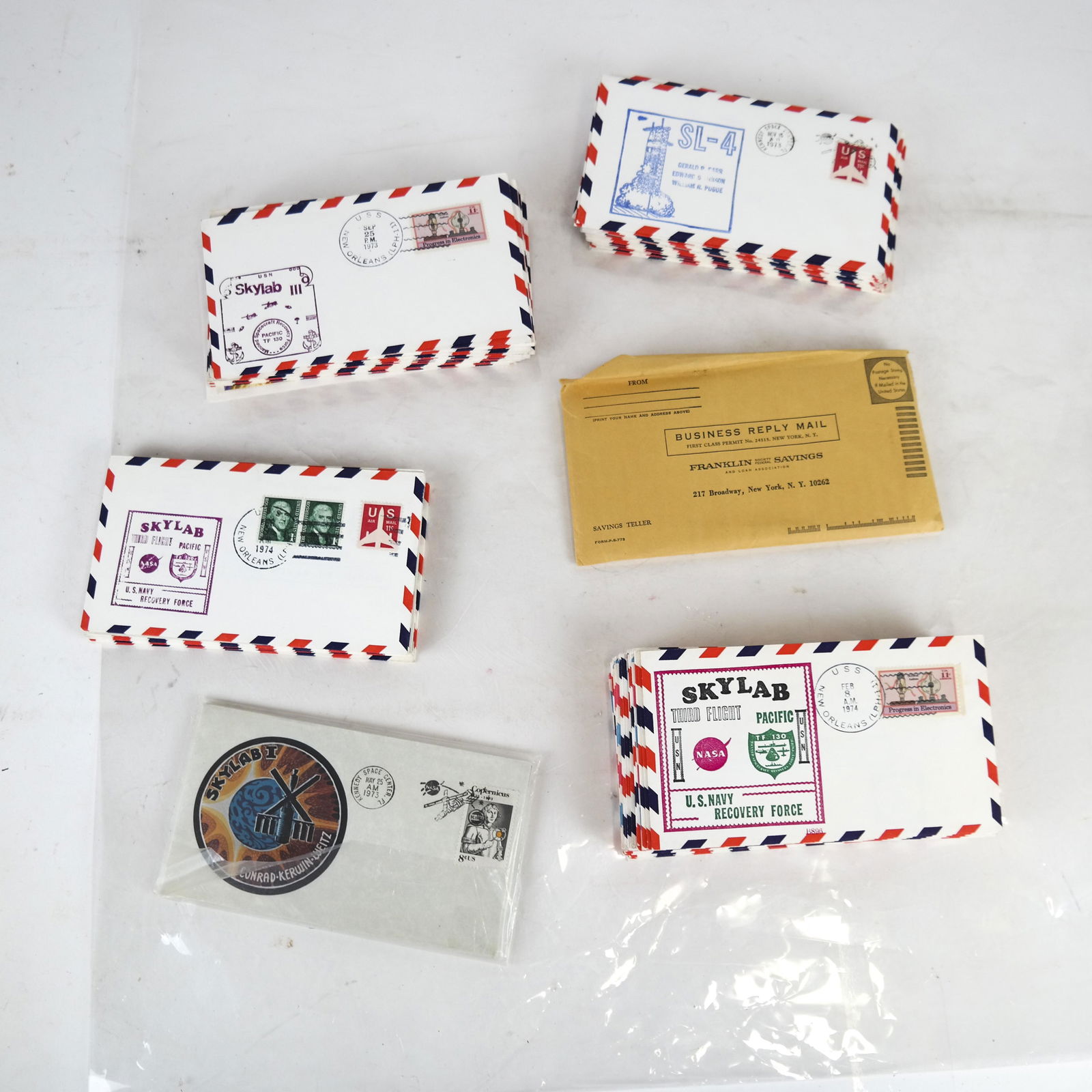 NASA SKYLAB Missions I-IV Postal Covers: Over 100 cached postal covers for SKYLAB Missions I, II III and IV, spanning 1973 through 1974. Most hand stamped postal cancellations. Issued aboard the U.S.S. New Orleans, with others issued from Ke