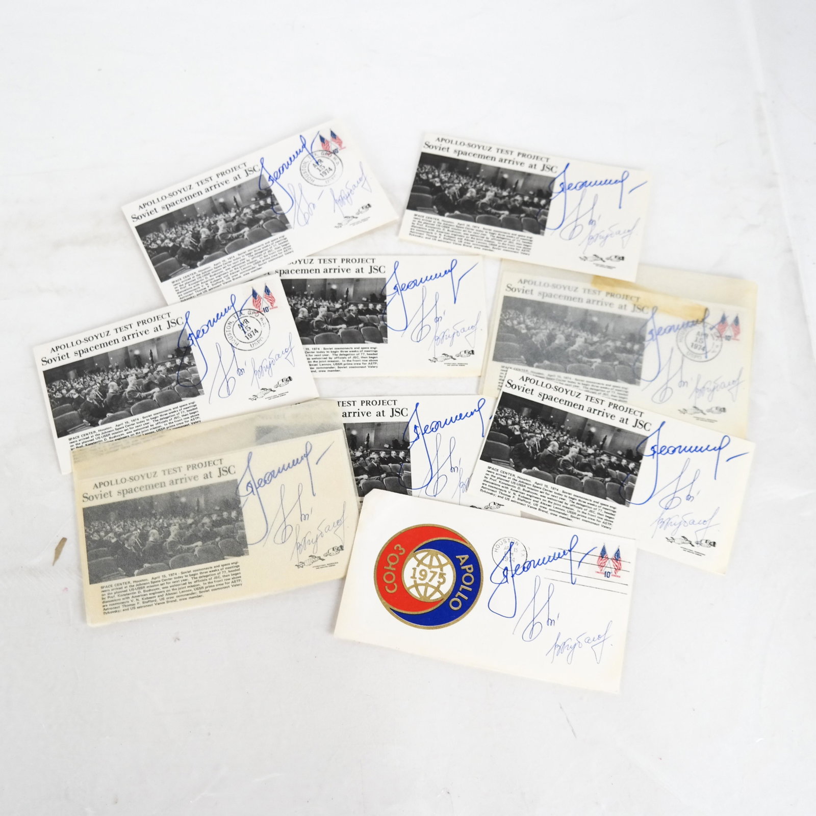 Group of 9 Cosmonaut-Signed Apollo-Soyuz Postcards: Soviet Union Space Program signed items from the crew of the Vostok-3 and Vostok-4 missions. Lot includes: 1) Signed postcard photograph of Pavel Group of 9 postcards imprinted "Apollo-Soyuz Test Proj