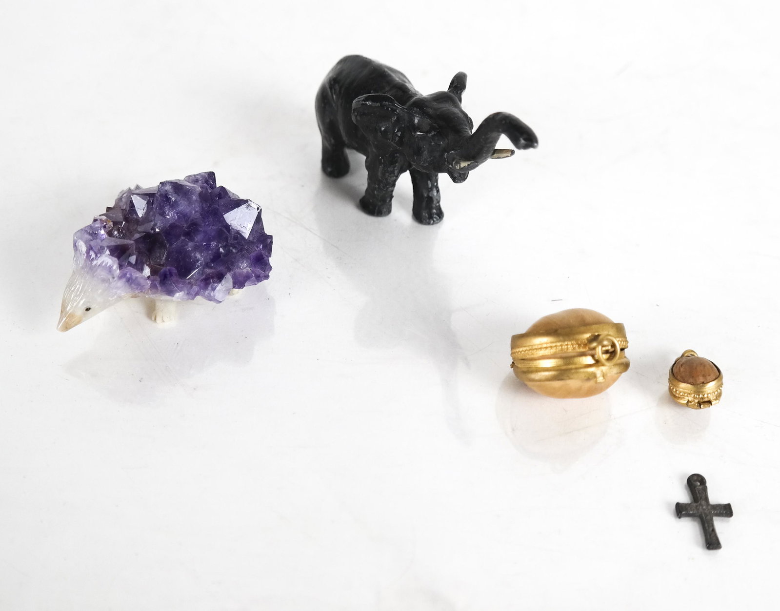 Lot Of 4 Items: Lot of 4 items including amethyst hedgehog, elephant, box with nut boxes, and a cross.