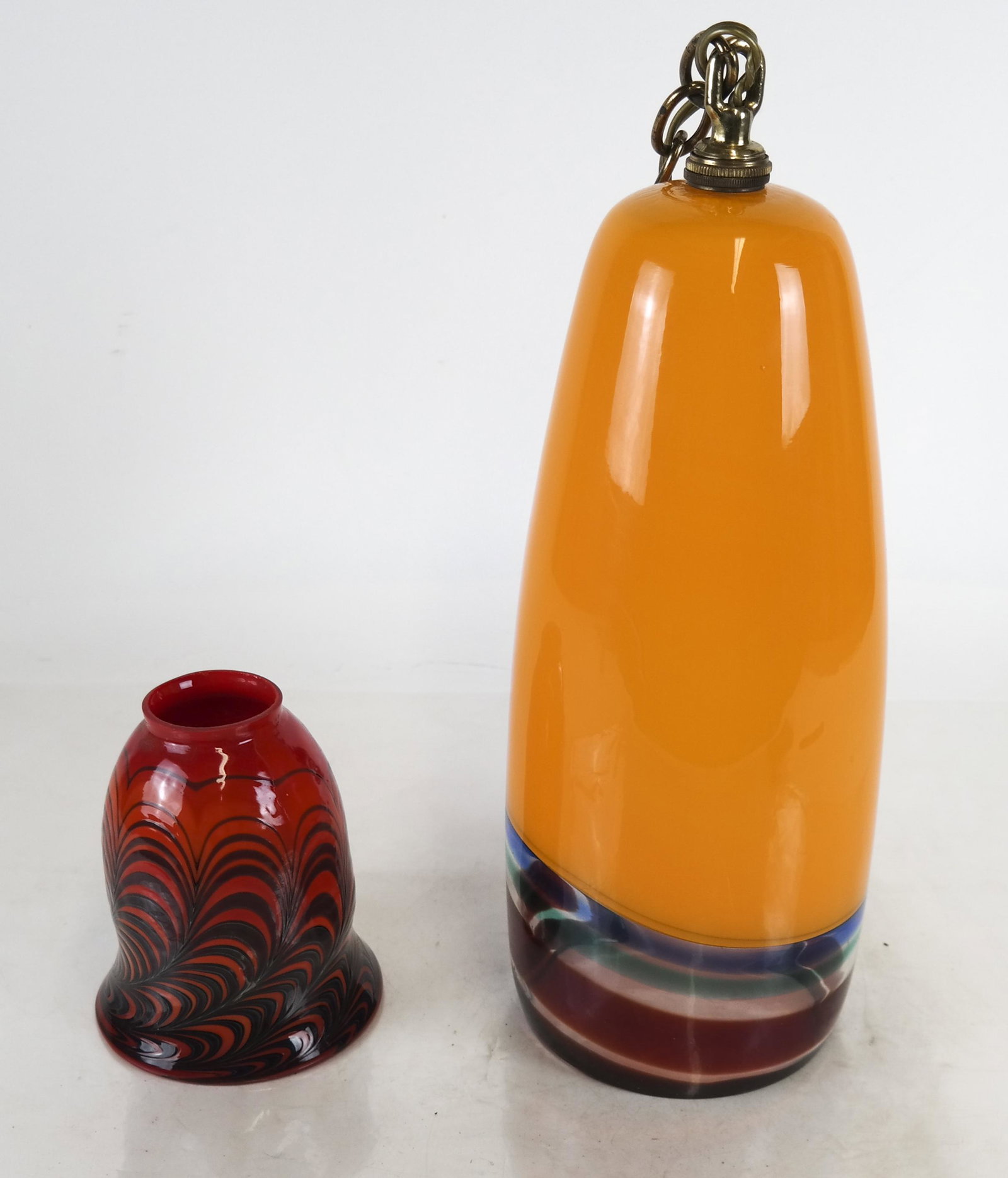 Art Glass Pendant and Shade: Murano-style orange and multicolor glass pendant light [16 x 5 inches] and one art glass shade [6 1/2 x 4 1/2 inches].