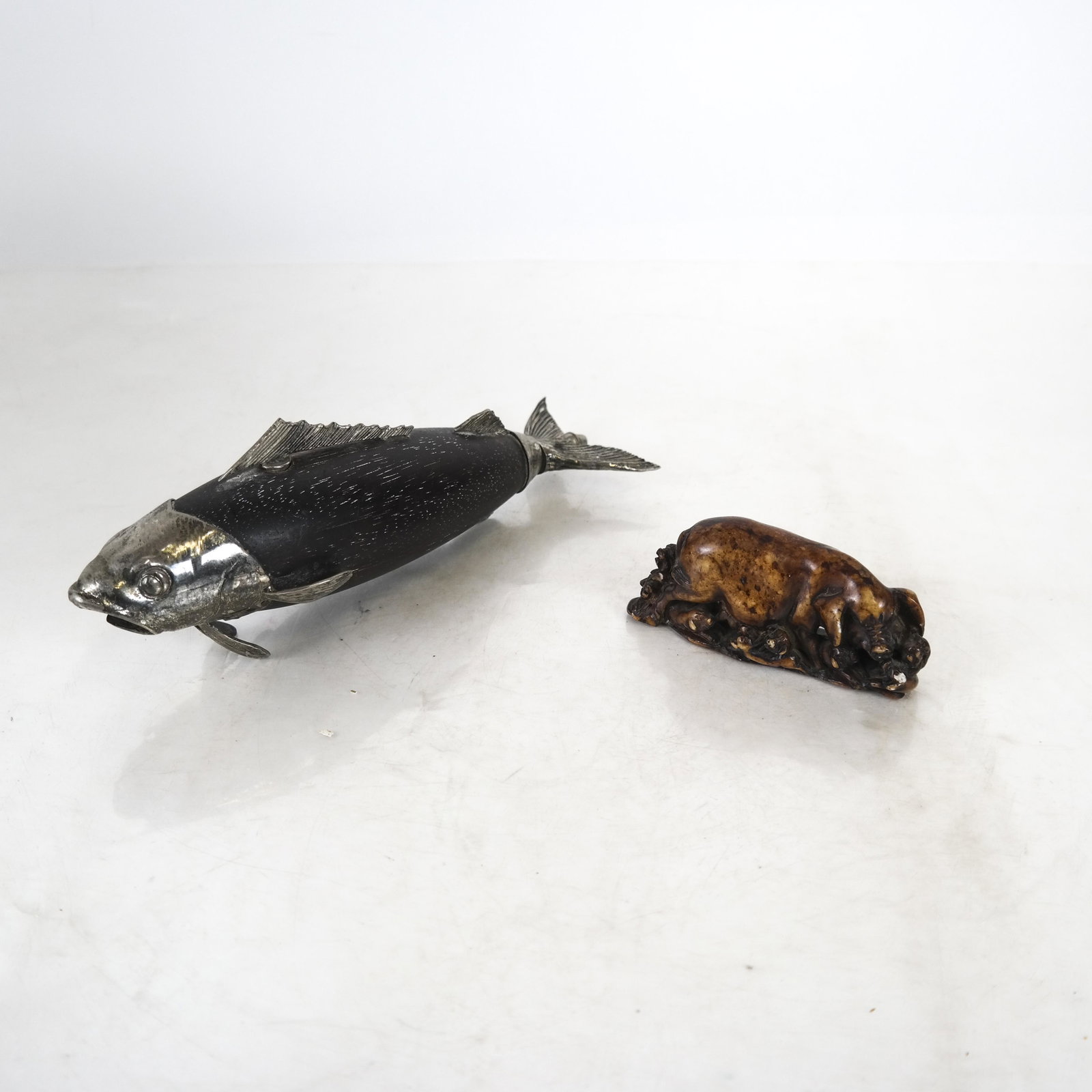 Stone Pig and Silver Plate & Wood Fish: Stone pig [2 x 4 inches] and silver plate and wood fish [3 x 8 1/2 inches].