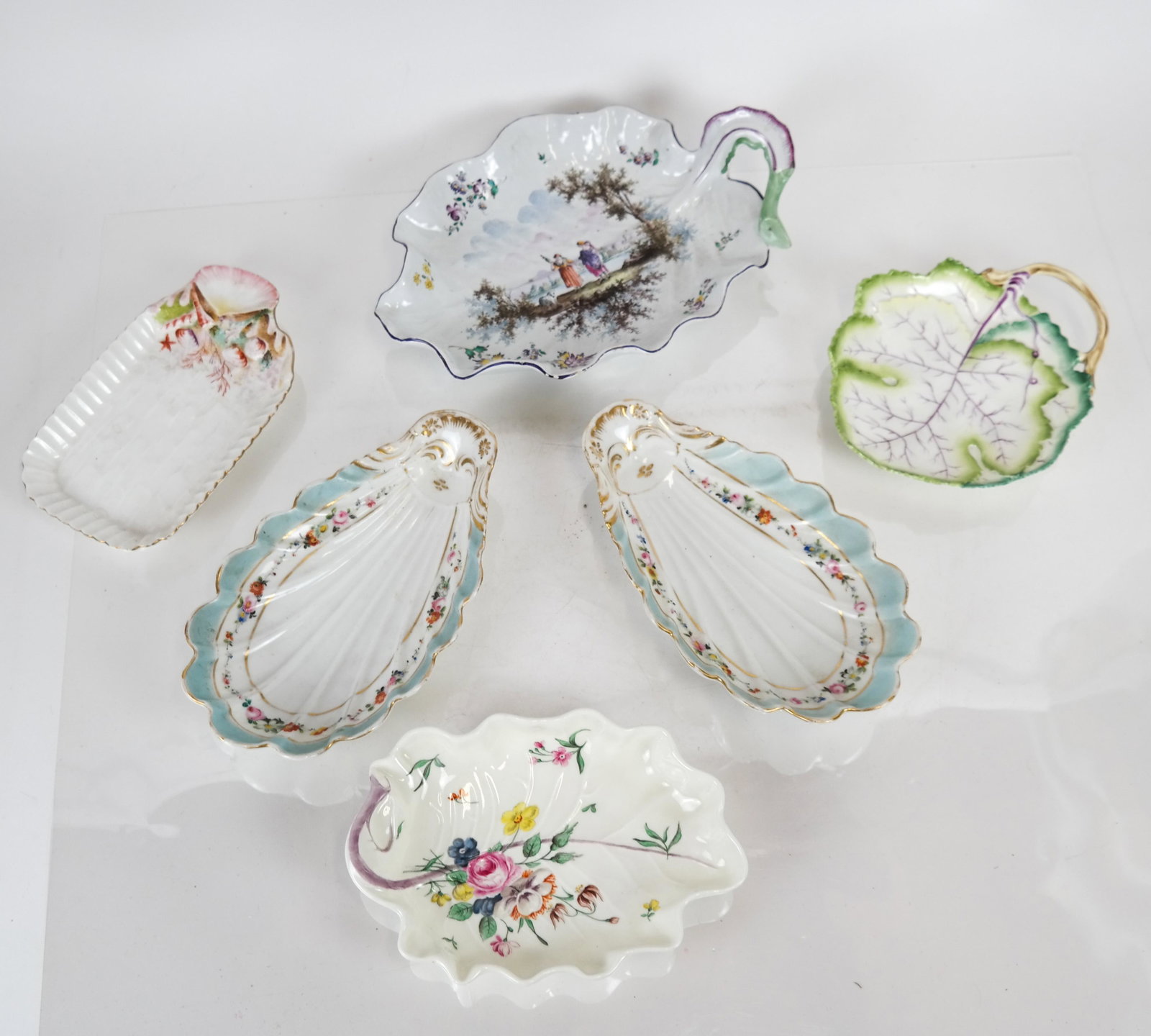 Six Various Porcelain Leaf-Form Dishes: Six leaf-form dishes and trinket dishes, including two by Royal Worcester. [Largest: 10 1/2 x 7 1/2 inches].