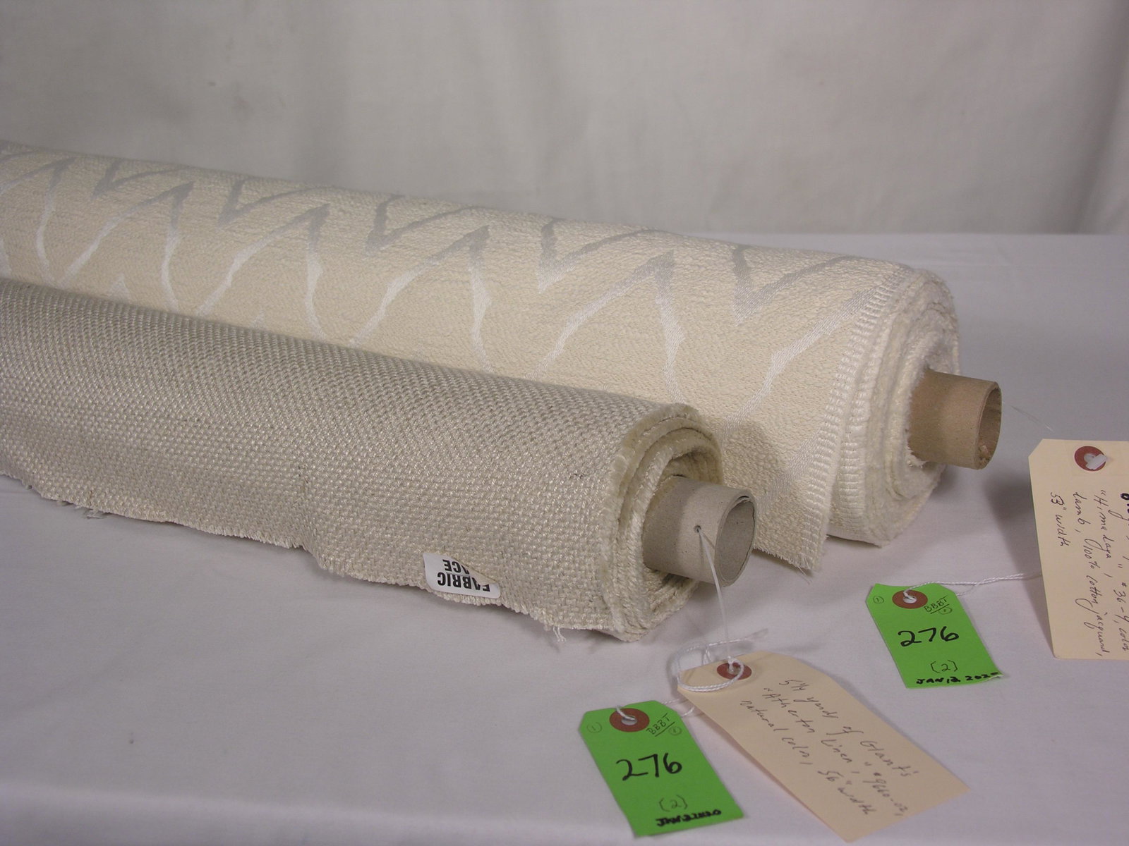FRET & Glant Natural Fiber Fabrics: 1) 8 1/2 yards of FRET's "Himalaya", #36-4. a Deco-style chevron boucle jacquard in 100% cotton. The lamb-colored upholstery has repeats of 3 1/4 inches x 4 1/2 inches horizontally across a 53-inch wi