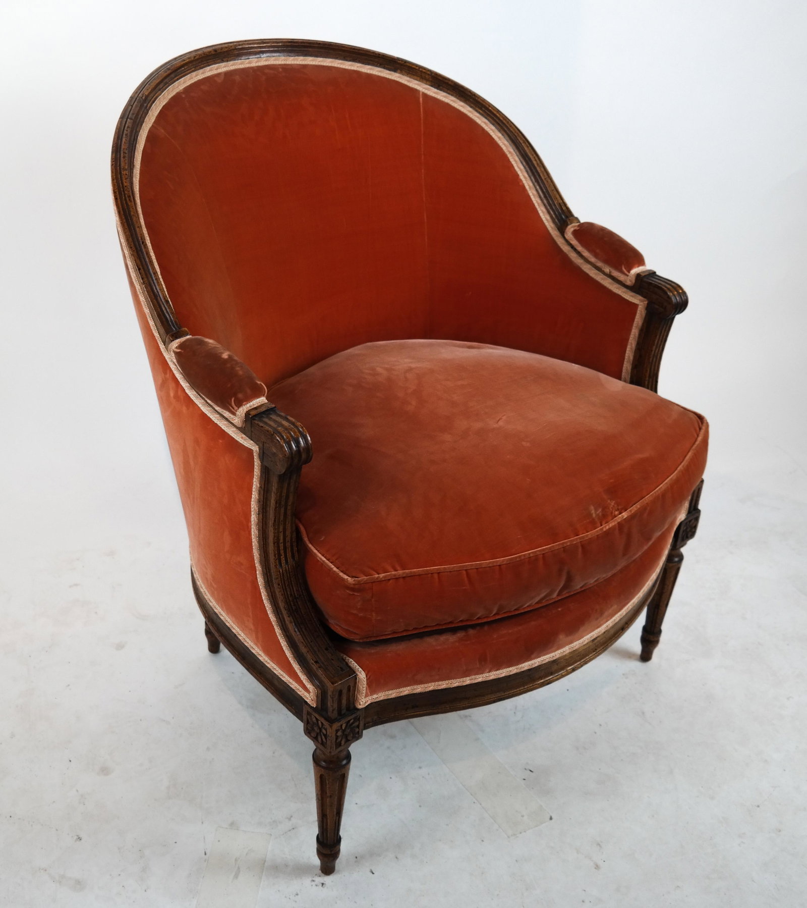 French Provincial Louis XV-Style Bergere: Louis XV-style bergere, possibly Yale Burge, with rust upholstery. [36 1/2 x 29 x 26 inches; 14 1/2 inches to seat].