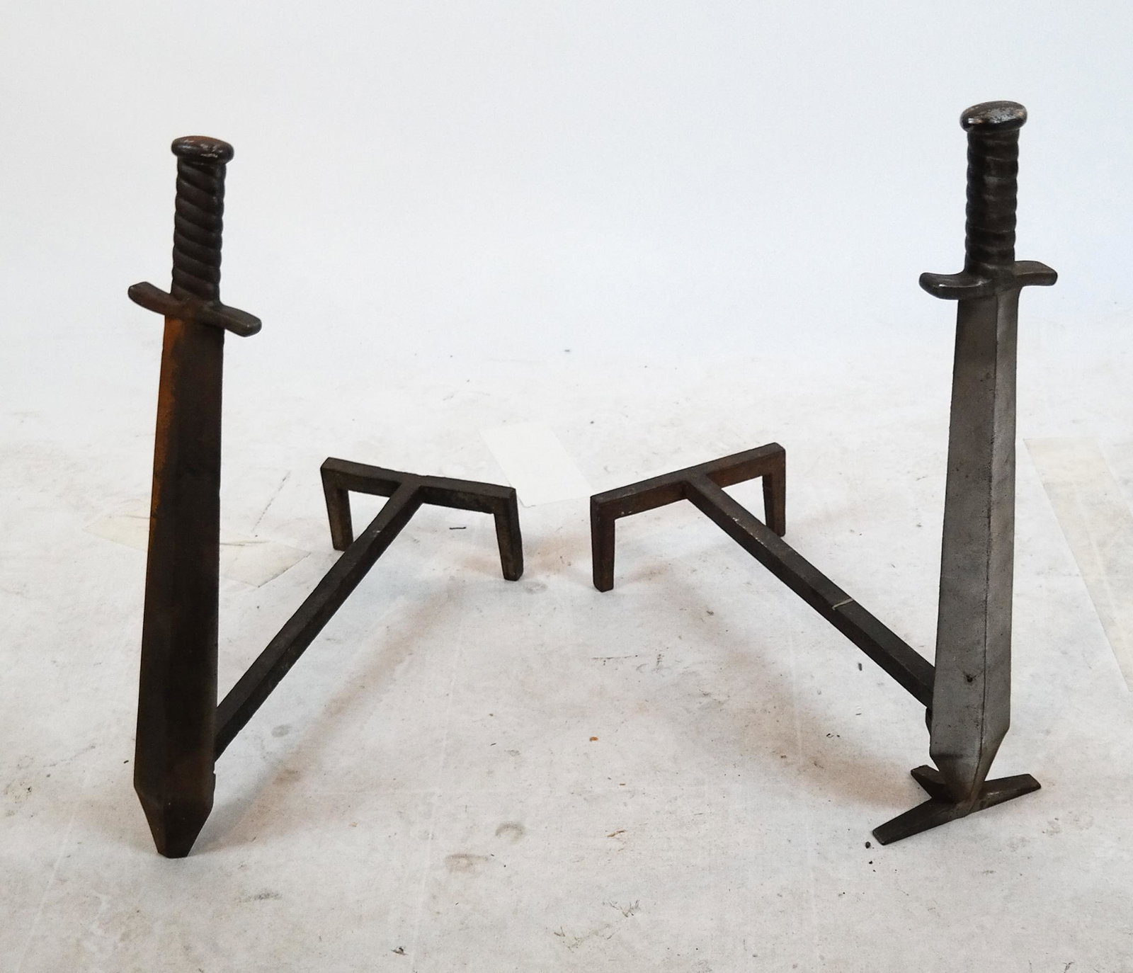 Sword-Form Iron Andirons: Pair of sword-form andirons. Easy assemble and disassemble. [24 x 6 x 20 inches].