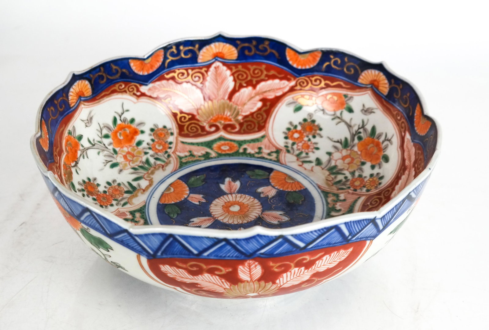 Antique Japanese Imari Porcelain Bowl: Antique Japanese Imari porcelain bowl. [3 1/2 x 9 1/2 (dia) inches]. Minor chips; in overall good condition.